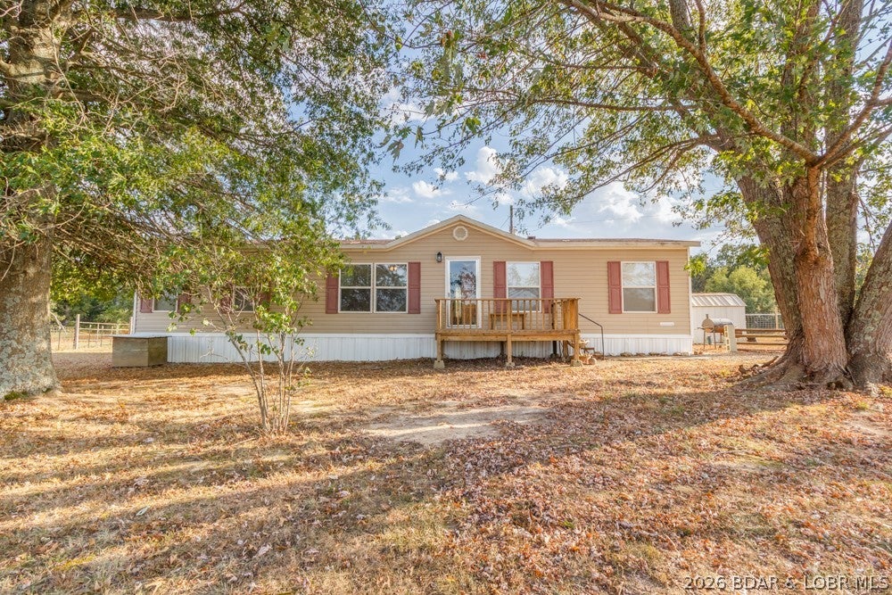Country living with room for horses, space to roam, and a convenient location! This 1,568 sq. ft. mobile home sits on 3.93 acres just outside Lebanon, located on the way to Lake of the Ozarks. Offering 3 bedrooms with a possible 4th bedroom, the home features an open floor plan, split-bedroom layout, and a spacious kitchen with tons of cabinet storage. The home is all electric and offers public water, a lagoon, and several recent updates, including a new HVAC system in 2023 and a new roof in 2025. The property is ready for your four-legged friends, too! The current owner has kept horses here, and the acreage includes multiple storage sheds along with a 12' x 24' Amish-built building that has been used as a horse barn. Whether you're looking for a place to enjoy country living, room for your animals, or a property with easy access toward the lake, this one is worth a look. Conveniently located just a short drive from Dollar General and Mike's Country Store. Come check out 19926 Jasper Rd and see what this property has to offer!