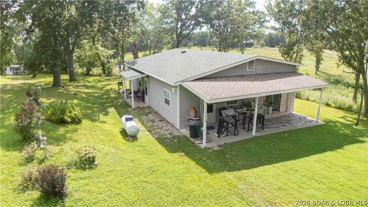 Discover the perfect blend of country living and investment potential with this unique property situated on 4.3 fully fenced acres. The cozy 1-bedroom home offers comfortable living, while the additional 448-square-foot dwelling unit provides endless possibilities. Complete with its own septic system, sink, toilet, and hot water heater, it’s ready to be finished, making it ideal as a guest house, rental, home office, or private living quarters. Outside, you’ll find plenty of room to work, play, and store your equipment. The 30’ x 18’ metal shop features a durable concrete floor, perfect for hobbies, projects, or business use. A storage shed with a metal roof and a convenient carport add even more functionality to the property. Whether you’re looking for a peaceful country retreat, a property with income potential, or space to expand, this versatile acreage offers endless opportunities.