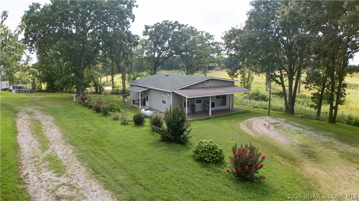 Discover the perfect blend of country living and investment potential with this unique property situated on 4.3 fully fenced acres. The cozy 1-bedroom home offers comfortable living, while the additional 448-square-foot dwelling unit provides endless possibilities. Complete with its own septic system, sink, toilet, and hot water heater, it’s ready to be finished, making it ideal as a guest house, rental, home office, or private living quarters. Outside, you’ll find plenty of room to work, play, and store your equipment. The 30’ x 18’ metal shop features a durable concrete floor, perfect for hobbies, projects, or business use. A storage shed with a metal roof and a convenient carport add even more functionality to the property. Whether you’re looking for a peaceful country retreat, a property with income potential, or space to expand, this versatile acreage offers endless opportunities.