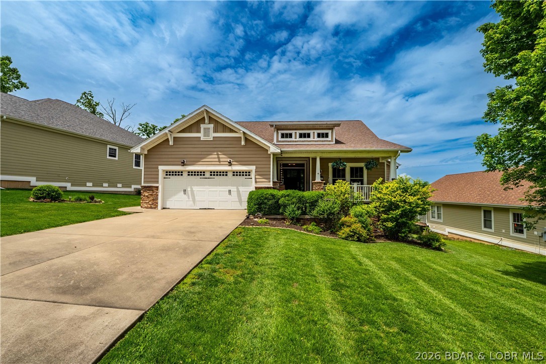 Located in a highly sought-after gated, golf cart-friendly community with incredible amenities, this beautifully designed Craftsman-style home offers over 3,500 sq. ft. of living space in the desirable Camdenton School District—less than 10 minutes to schools and shopping! Residents enjoy a true neighborhood feel with a clubhouse, pool, tennis/pickleball courts, and street lighting. This spacious 4-bedroom, 4-bath home showcases quality finishes including granite countertops, hardwood flooring, stainless steel appliances, tile backsplash, coffered ceilings, and a warm gas fireplace. The expansive primary suite offers a private retreat with a sitting area and spa-inspired bath featuring a jetted tub. Designed for relaxing and entertaining, enjoy the impressive 438 sq. ft. screened porch with composite decking and a cozy gas fireplace just off the dining area—perfect for year-round enjoyment and beautiful views. The lower level features a second family room, full kitchen/bar, and access to a covered concrete patio and flat backyard. Beautiful landscaping and an automatic irrigation system complete this exceptional home offering comfort, convenience, and community living