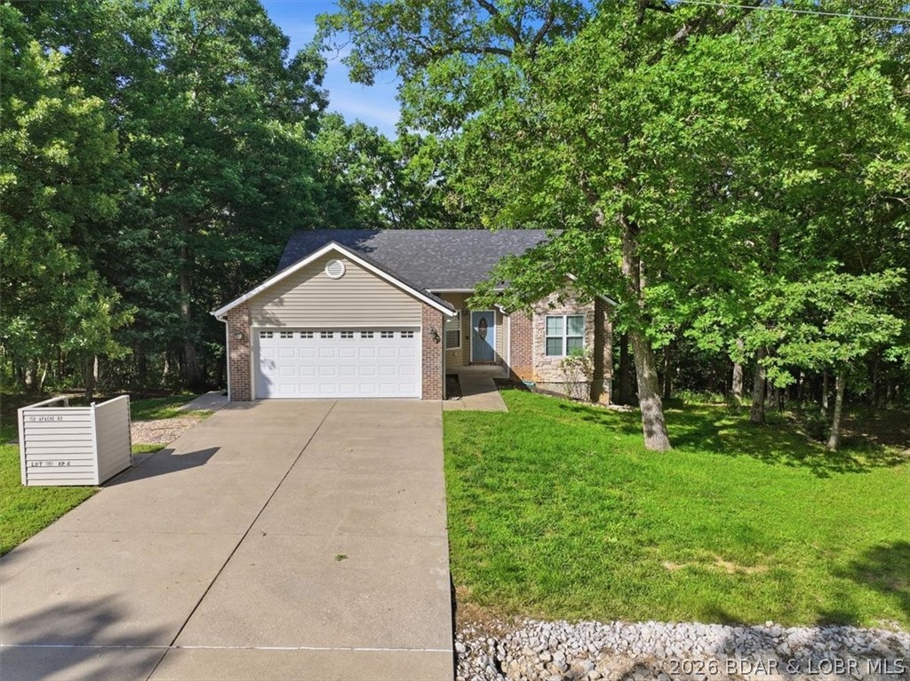 Experience the perfect combination of comfort and space in this beautifully maintained 5-bedroom, 3-bath home offering 2,918 square feet of inviting living space. Nestled in the highly sought-after Four Seasons community, take advantage of the incredible amenities just minutes from your doorstep.

The open-concept main level features an inviting living room with abundant natural light, a well-appointed kitchen with ample cabinetry and workspace, and a dining area perfect for gathering with family and friends. The primary suite provides a relaxing retreat, while additional bedrooms offer plenty of room for guests or a growing family. The finished walkout lower level expands your living space with a large family room ideal for entertaining. Outside, enjoy the peaceful wooded setting from the privacy of the deck or patio.

Complete with an attached two-car garage, generous storage, and the added peace of mind of a newer roof, this home offers both comfort and lasting value. Located just minutes from shopping, dining, golf, and everything Lake of the Ozarks has to offer. Don't miss your chance to own this exceptional property in one of the lake's most sought-after communities!