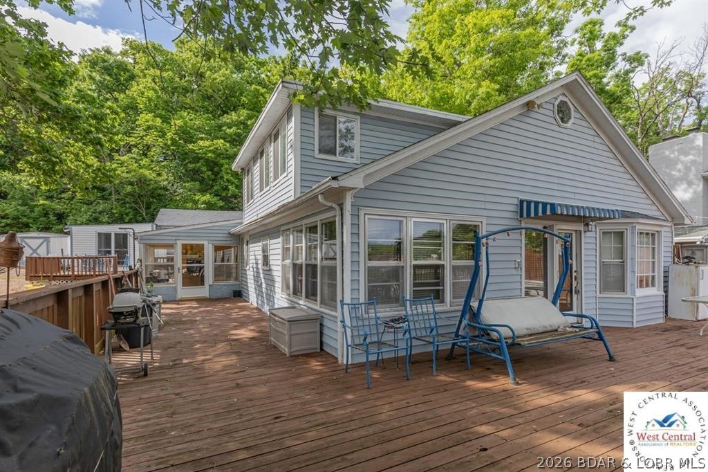 Lake of the Ozarks family oasis ready and available for you and yours to enjoy! This one-of-a-kind lake property has all that you could want...and more! The main home is 4 beds, 3 bath and has two additional sleeping areas. Plenty of room to host the entire family. As if the main home didn't have enough elbow room, this property also comes with the perfect studio guest cabin right next door. Guest cabin has its own kitchenette and full bath. Enjoy the private deck here or head back over to the main house to hang out with everyone else on the HUGE 28x45 deck. Take in the view of this quiet cove or take the gentle slope walk down to the private 2 well dock on good deep water! Additional cabin available for more $$.