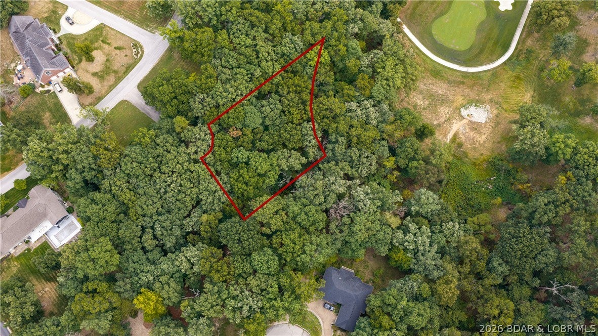 An exceptional opportunity to build in Osage National! Lots 220 & 221 combine for approximately 0.95 acres in a desirable cul-de-sac setting overlooking Hole #7 of The Mountains Course. The mostly level building area transitions to a gentle rear slope, creating an ideal setting to take advantage of the beautiful golf course views. Located within the renowned 27-hole Arnold Palmer-designed Osage National Golf Resort, this property offers access to an impressive community lifestyle with clubhouse dining, a zero-entry pool, fitness center, pro shop, playground, and golf cart paths. City water and city sewer add convenience when planning your future home, and completed home plans are available for added inspiration. Just off Highway 54, Osage National provides convenient, quick access to Lake Ozark and Osage Beach shopping, dining, entertainment, marinas, and everyday necessities. Bring your vision and create your own home in one of the last available lots at Osage National.