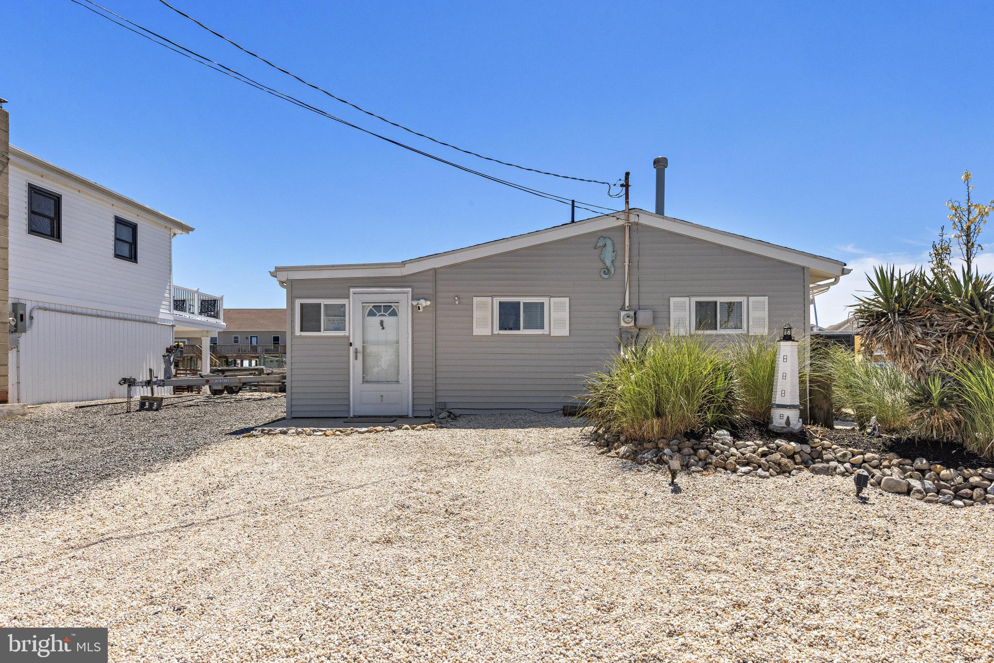Welcome to life on the water! This 3 bedroom, 1 bathroom home is a great fit for boaters, water lovers, and anyone looking to enjoy a relaxed coastal lifestyle. Located in a great boating location with quick access to the bay, it's easy to see why so many people love this area. Designed for both relaxation and entertaining, the backyard features a patio, pergola, pool, vinyl bulkhead, floating dock, and ample storage space in the shed, creating the perfect place to enjoy long summer days with family and friends. Inside, the kitchen features brand new appliances, while the spacious family room is filled with natural light and overlooks the water, creating a bright and inviting atmosphere throughout. Additional updates including a newer roof and hot water heater provide peace of mind for years to come.  Whether you're spending the day on the boat, relaxing by the pool, or taking a short drive to Long Beach Island's beautiful beaches, this home makes it easy to enjoy everything coastal living has to offer.