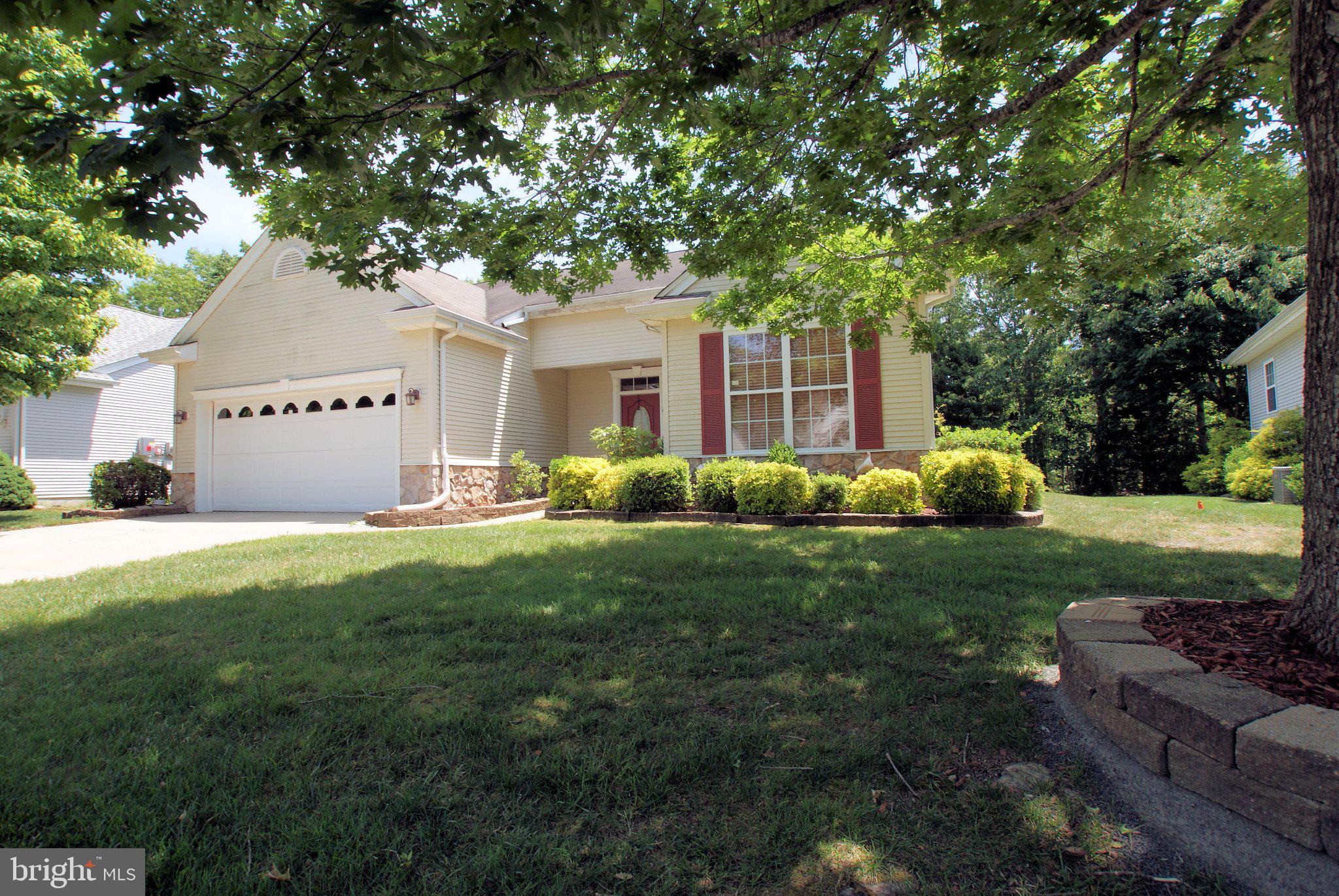 This ranch home, built in 2001, offers 1,614 sq. ft. of inviting living space, featuring an open floor plan that seamlessly connects the living and dining areas. Enjoy cozy breakfasts in the sunlit breakfast nook, or unwind in either the attached porch or on the back semi-private patio with nice landscaping all around.  The home has two spacious bedrooms and two full baths. The  kitchen comes equipped with essential appliances, including a dishwasher, stove, and refrigerator, making meal prep a breeze. Step outside to enjoy the community amenities, including a refreshing outdoor pool, tennis courts, and a welcoming clubhouse perfect for social gatherings. With an attached garage and ample driveway space, parking is never a concern. Embrace a lifestyle of comfort and connection in this wonderful community, where every day feels like a vacation. Your new home awaits!