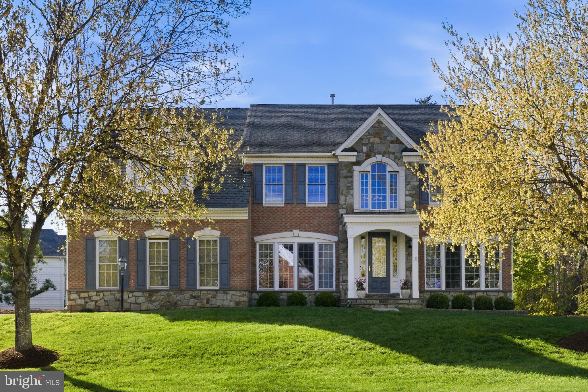 NEW PRICE!  It's a Great price for this neighborhood - check out the comps! COME SEE this  GORGEOUS home on a HALF ACRE HOMESITE!  Motivated Sellers!<br><p>

This warm and welcoming home offers BEAUTIFUL SPACES and timeless charm in the sought after UPSCALE NEIGHBORHOOD of FOREST MANOR. Light HARDWOOD FLOORS flow through the main level, leading to a STUNNING TWO STORY FAMILY ROOM featuring a dramatic floor-to-ceiling STONE FIREPLACE, statement chandelier and LARGE DECORATIVE WINDOWS that fill the home with NATURAL LIGHT. The main level offers plenty of spaces for living, dining and entertaining, including a SUNROOM and OFFICE.
The kitchen features GRANITE COUNTERS, STAINLESS APPIANCES (including a new SS Fridge), plenty of cabinet space, and a LARGE ISLAND, perfect for everyday living and entertaining!
Upstairs, the HUGE PRIMARY SUITE has vaulted ceilings, a sitting area, 2 CUSTOM WALK IN CLOSETS, and an elegant bath with DUAL VANITIES, a soaking tub, and a FRAMELESS  SHOWER DOOR. An additional bedroom with ENSUITE BATHROOM , plus two more bedrooms and a full hall bath, complete the upper level. 
A fully FINISHED BASEMENT adds even more living and entertaining space, and the STONE PATIO, and LARGE FLAT YARD s ideal for enjoying the outdoors. <br><p>
Located in the highly desirable BRIAR WOODS HS  - Eagle Ridge MS pyramid and just minutes to the ASHBURN METRO and Brambleton Town Center with great dining options, shopping, entertainment, and community events—this home offers an unbeatable combination of comfort and convenience.  Come see it!