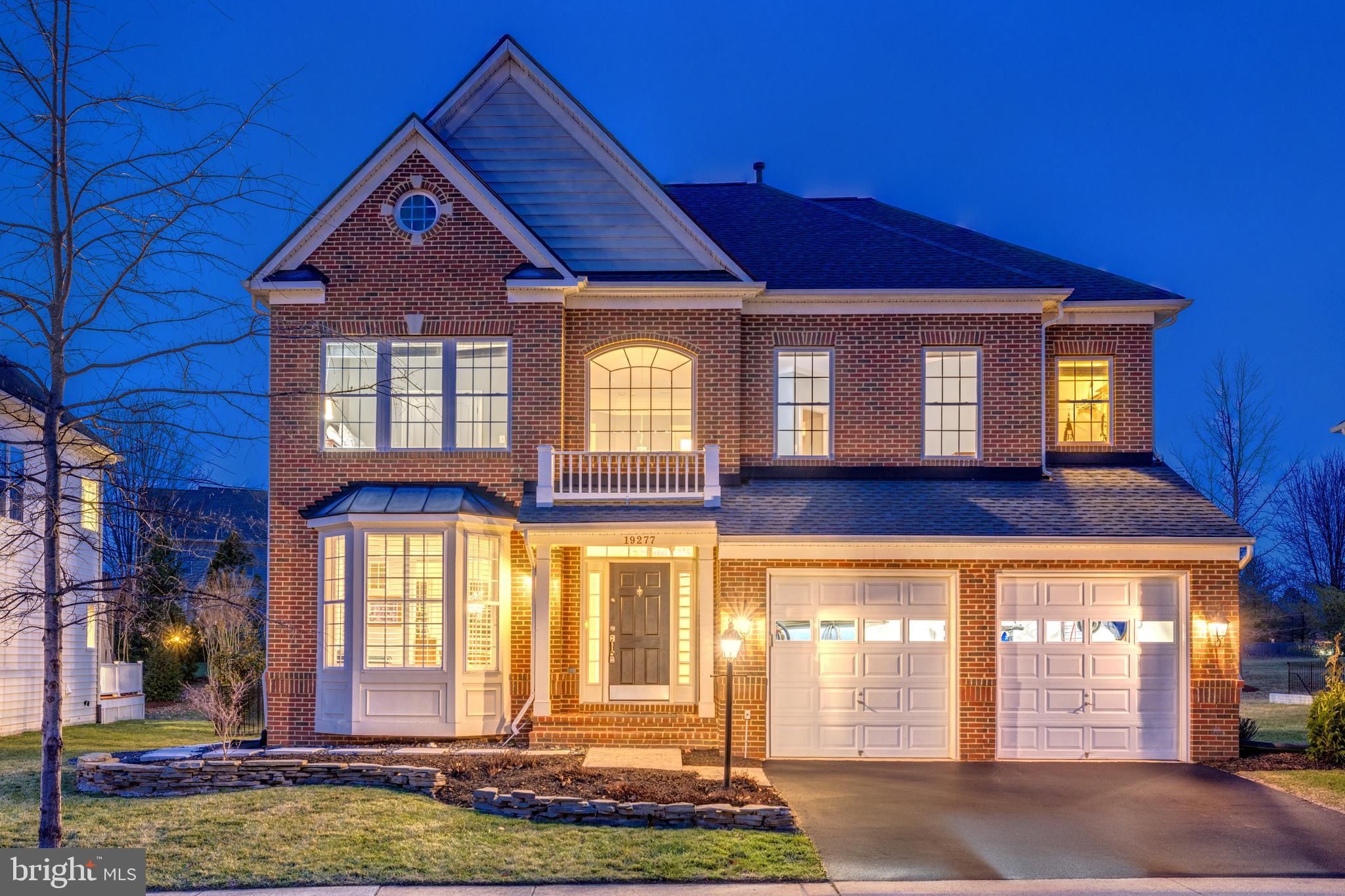 Open House Sunday March 16th 2-4pm**Timeless Design Meets Modern Comfort. Enjoy indoor-outdoor luxury and extensive upgrades at this Contemporary Colonial home within Lansdowne on the Potomac. Arrive on tree-lined streets to the picturesque, brick-front residence. Inside, a grand two-story foyer introduces refinished hardwood floors that continue through the main level and stairs. Classical architectural elements grace the formal living and dining rooms, including bay windows, chair rails and wainscoting, and an ornate chandelier with ceiling medallion. The eat-in kitchen was recently remodeled, featuring a center island with bar seating and upgraded stainless appliances, including a Bosch dishwasher, Wolf 4-burner cooktop with griddle, Wolf wall oven, and Wolf microwave. Flow from the kitchen into the family room centered around a floor-to-ceiling stone gas fireplace. The main level powder bath was just remodeled in 2024. Upstairs, all four bedrooms are conveniently located together. The impressive primary suite features a private sitting area, tall tray ceiling, two walk-in closets, and an en suite bath with corner soaking tub, separate shower, and double sinks. Three more spacious bedrooms and a full remodeled bath complete this level. The finished walk-up lower level expands your living space with a flexible recreation area and upgraded kitchenette, full bathroom with updated vanity and faucet, and a bonus room perfect for guests, a gym, or home office. A utility room provides extra storage. The home’s outdoor spaces are equally inviting: relax on the updated deck, installed 2023 with TimberTech Legacy premium decking, or down on the paver patio and lawn with sprinkler system. An updated black aluminum fence surrounds the yard, all backing to mature aspen trees and common area. Additional recent updates include: new roof (2019/2020), new furnace (2020), new thermostats (2024). The location provides easy access to Lansdowne's amenities, including indoor/outdoor pools, fitness center with aerobics rooms, amphitheatre, playgrounds, tennis, pickleball, and volleyball courts, tot lots, recreation center with meeting rooms and ballroom, business center, game room, plus miles of trails connecting to Potomac Heritage Scenic Trail network. Conveniently close to Route 7, Lansdowne Town Center shopping/dining options, Golf Club at Lansdowne, Lansdowne Resort & Spa, hiking trails and Elizabeth Mills Riverfront Park. Experience relaxed living in this highly upgraded home in one of Loudoun County's most desired locations.