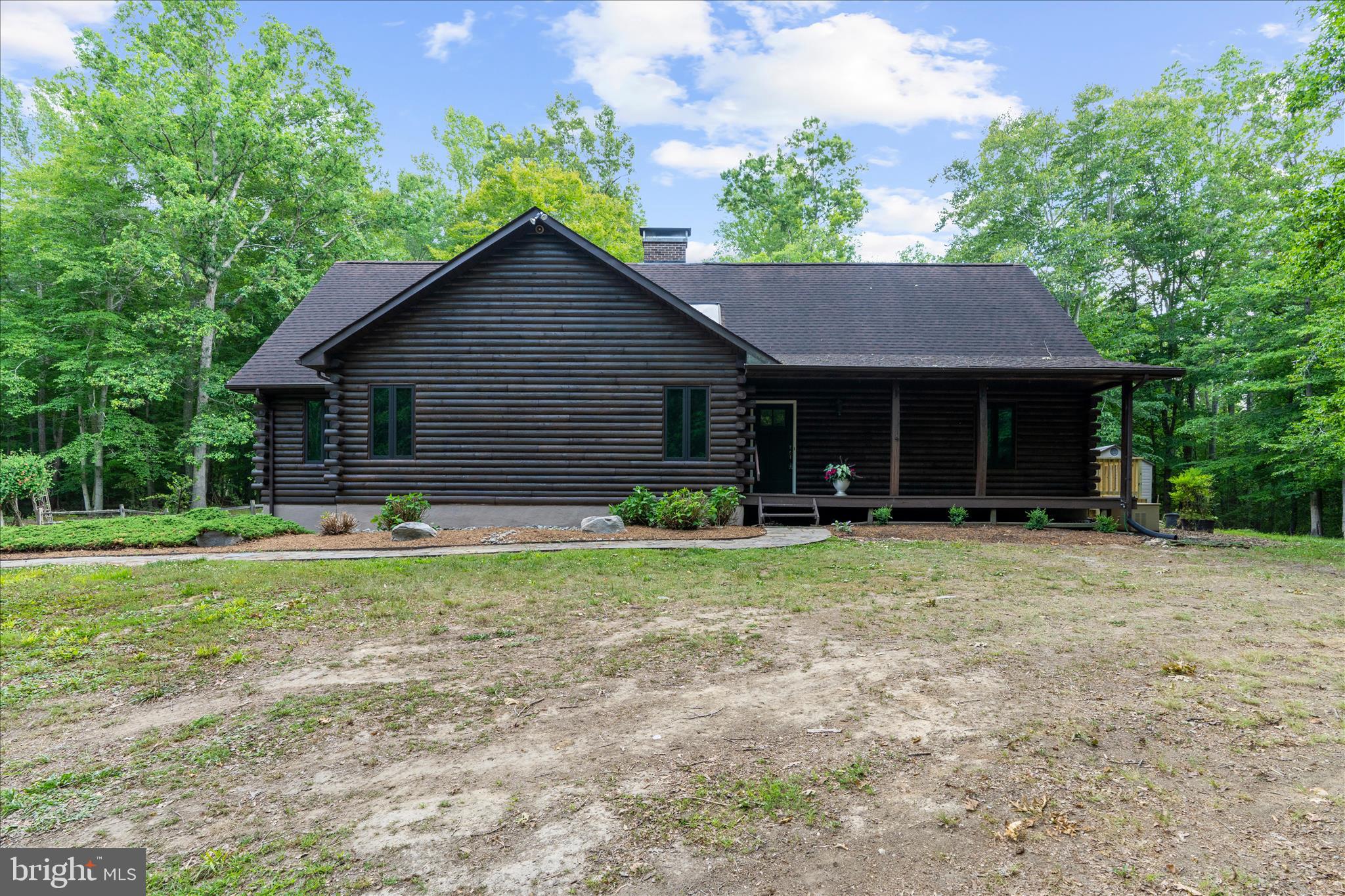 Welcome to your own private retreat! This property is nestled on nearly 10 acres' this stunning log-style home offers almost 5,000 square feet of living space and is the perfect blend of rustic charm and modern convenience and peaceful seclusion. Deigned for entertaining, relaxing and enjoying nature, this one of a kind property provides the ideal setting for hosting gatherings, creating lasting memories, or simply escaping to your own private oasis. From the moment you arrive, you'll be captivated by the vaulted ceilings, breathtaking wood burning fireplaces, and the warm character that only a true log home can provide. The spacious custom kitchen offers ample room for preparing meals and gatherings. Gorgeous custom fireplace mantel adds to the home's exceptional craftmanship and charm. Enjoy your morning coffee or evening sunsets from the beautiful screened in porch overlooking the serene surroundings. Storage is abundant throughout the home, offering plenty of space for all your needs. Additional features include a reverse osmosis drinking water system, generator for peace of mind during power outages, wood burning furnace in the basement tied into the home's primary heating system, new AC unit installed in 2025, new attic fan motor, and asphalt driveway completed within the last 3 years. The detached garage offers electricity and additional storage or workshop space, while both the basement and detached garage feature plumbing rough-in's for future possibilities. Pet owners will appreciate the fenced dog run complete with water access and dedicated pump. Whether you're looking for a full time residence, a weekend getaway, or a private retreat surrounded by nature, this extraordinary property truly offers it all. Opportunities to own a home this special are rare. Homes like this don't come along often, schedule a private showing today.