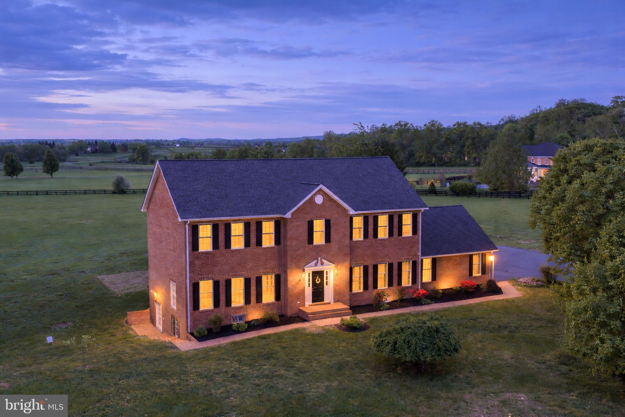 Rare 4 sides brick home on 10.62 acres in sought-after Lees Crossing—where privacy, open space, and country living come together just minutes from downtown Leesburg, VA. This exceptional property offers the rare combination of usable acreage, scenic views, and a peaceful setting—perfect for those dreaming of space for a pool, outdoor entertaining, or simply room to breathe and relax.
For equestrian enthusiasts, this is a standout opportunity. Located in one of the few horse-friendly communities in the Leesburg area, the neighborhood is thoughtfully designed with equestrian living in mind, offering access to approximately 3 miles of riding trails, with an HOA that actively supports the lifestyle. Just minutes away, Morven Park provides even more miles of trails and hosts world-class equestrian events. If you don’t have horse you will love the scenic views and tranquility.

Inside, the home features a light-filled, comfortable layout with generously sized living and dining spaces and an eat-in kitchen designed for everyday living. The main-level bedroom and full bath offer flexibility for guests, multi-generational living, or a private office. The family room with wood-burning fireplace creates a warm, inviting space to gather off the kitchen area. 

The updated kitchen includes a tile backsplash, double wall ovens, and an electric cooktop with downdraft, along with a separate main-level laundry room for convenience. A back staircase adds character and flow, while the upper-level loft provides the perfect loft work-from-home space filled with natural light.

Upstairs, the primary suite offers a beautifully remodeled bath (2026) with new flooring, vanities, lighting, and a relaxing soaking tub. Three additional spacious bedrooms and a hall bath complete the upper level.

The walk-out lower level expands your living space with a bright, open recreation room ideal for movie nights or entertaining, plus a bonus room, full bath, and wet bar, perfect for guests or easily converted into a private suite or kitchenette. A large storage area and additional laundry hookup add even more flexibility.

Step outside and experience what makes this property truly special. A tree-lined driveway sets the tone, leading to a home surrounded by open land, stunning pastoral views, and a stream along the property’s edge. The brick patio and Trex deck create the perfect setting for outdoor dining, entertaining, or simply enjoying the quiet beauty of the countryside. With over 10 acres, there is ample space for a horse barn, paddocks, gardens, or future outdoor amenities. Bring your chickens, goats, sheep, and horses are welcome.  

Recent updates include a new roof (2025), new upper-level windows (2025), HVAC (2020), plus an air scrubber and UV light system. An oversized garage with automatic opener. More recently updated items:
2023 New electrical panel,  Electric Car charger 240V EV in garage.
2024 kitchen remodel
2024 new composite deck
2025 radon remediation system
2025 new hot water heater
2025 new well pressure tank
2026 Brand new well water filtering system
All of this is ideally located just minutes from the heart of Leesburg, Lucketts, Roots 657, and major conveniences like Wegmans, Costco, and the Leesburg Outlets—while still offering a true escape to country living. Easy access to Route 7 and Route 15 makes commuting simple.
This 750-acre community is enriched with gently rolling topography and is located in Virginia's lush Loudoun County landscape.  This community is blessed with scenic views of the Sugarloaf Mountain, the Catoctin Mountains and natural tree line borders that enhance the community.  It is conveniently located five miles north of Leesburg, six miles from the Dulles Greenway, 25 minutes from Frederick, Maryland and 40 minutes from Washington DC.  
If you’ve been searching for acreage, privacy, and the lifestyle that comes with it, Don’t miss this rare opportunity in Leesburg.