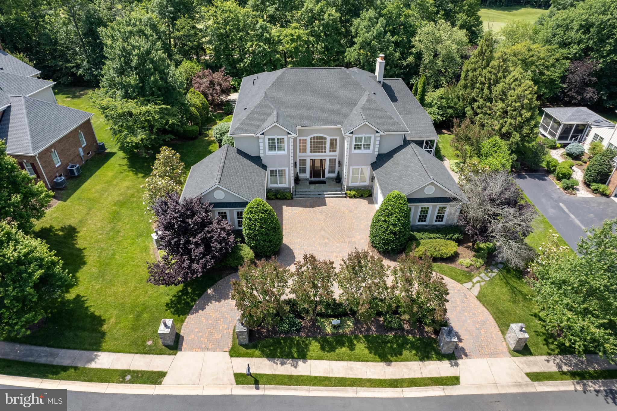 This meticulously upgraded residence was designed for both grand entertaining and calm retreats. This home sits in a cul-de-sac, with a sub-community of 12 homes. Quiet street and once the Former Model Home.  Travertine flooring (limestone) found on the main level. BONUS: In-law suite on the 1st floor with full bath and large closet.  It features multiple luxurious gathering spaces, resort-style outdoor amenities, and elegant architectural detailing throughout — all within one of Ashburn’s most coveted gated neighborhoods. Whether you’re hosting guests poolside, enjoying theater-level entertainment, or watching the sunset from your terrace,  this home sets a benchmark in upscale living. This elegant entertainer's estate offers  6 Beds, 5 Full/2 Half Baths,  and over 10,000+  sq.  ft. of living space.

Nestled in the gated Belmont Country Club community, this custom semi‑built estate sits on approximately 0.54 acres with impressive views of a golf course and serene lake from the upper‑level terrace.
Spacious luxury living across two family entertainment floors and finished lower basement.  See the 
spectacular outdoor spaces: Designed for entertaining with a salt‑water pool and spa, expansive patio and hardscape, screened porch, plus a veranda with outdoor kitchen/ gas grill and wood‑burning fireplace. 
Stunning Interiors include rich travertine and hardwood flooring, soaring ceilings, custom moldings, a grand foyer with butterfly staircases, and a double‑sided fireplace linking the family room and kitchen. The gourmet kitchen is equipped with commercial-grade stainless steel appliances, a center island, a custom pantry and opens to the family room. The versatile main level living includes a spacious in-law suite, extensive built-ins, and a solarium party/music room with a built-in bar. Must see in person to appreciate the beauty of this magnificent home.

Amenities Galore: Finished four-car garage; professionally designed multi-level theater, full dance floor, designer decor, and impeccable, move-in ready condition with over $500k in builder upgrades. The entire roof was recently replaced, and electric shades throughout the home will convey.