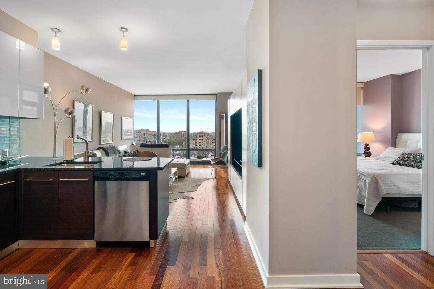 Welcome to Unit 1008 at the highly sought-after Murano, located at 2101 Market Street in the heart of Philadelphia. This stunning one-bedroom, one-bath residence offers 743 sq. ft. of modern living space, featuring floor-to-ceiling windows that flood the home with natural light. The open-concept layout seamlessly blends the kitchen, dining, and living areas, creating an inviting atmosphere perfect for both relaxation and entertaining. The contemporary kitchen boasts sleek cabinetry, stainless steel appliances, and granite countertops. The spacious bedroom includes ample closet space, while the well-appointed bathroom features modern finishes. Additional highlights include in-unit laundry, hardwood flooring, and access to premium Murano amenities, including a 24-hour concierge, a state-of-the-art fitness center, an indoor heated pool, and an exclusive resident lounge. This unit also comes with the convenience of included parking and storage, a rare find in Center City living. Don't miss this opportunity to experience luxury high-rise living in one of Philadelphia premier buildings!
(Some listing photos are from another unit with the exact same layout.)