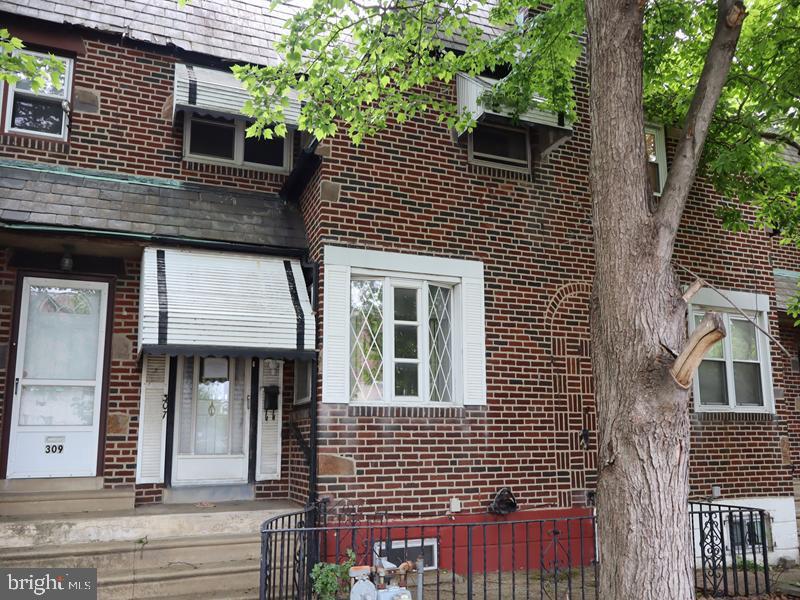 Welcome to this charming two-story brick row home, built in 1940. The property offers a spacious layout featuring a bright living room, formal dining room, and a well-appointed kitchen, along with a rear enclosed porch that provides additional versatile living space.

The upper level includes three comfortable bedrooms and a three-piece hall bathroom and convenient powder room in main bedroom. The fully finished lower level offers added convenience with a powder room, enhancing functionality for everyday living and entertaining.

Exterior features include rear driveway parking as well as ample on-street parking. Ideally located, this home is just minutes from local shopping, public transportation, and major roadways, offering excellent accessibility and convenience.