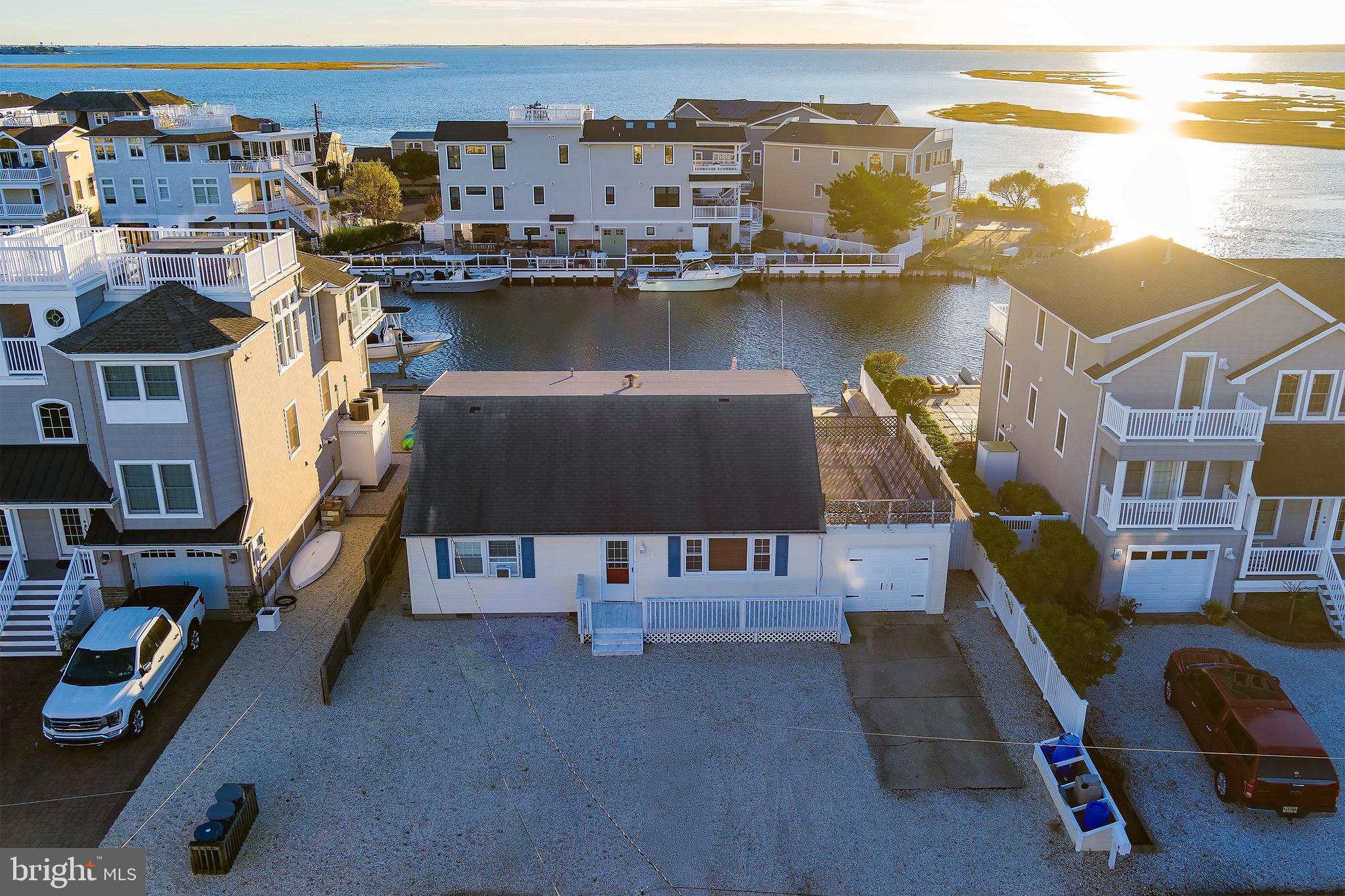 Bring your vision to life on this prime lagoon-front lot in High Bar Harbor just five houses from the open bay. The existing four-bedroom Cape sits on a 60x100 ft lot with direct bay access, vinyl bulkhead, floating dock, and private boat ramp ideal for launching your jet ski, kayak or small boat.  Enjoy south-facing sunsets over the meadow and watch the wildlife and boats entering the lagoon.

The current home is in need of updates and being sold as-is, offering a rare opportunity to tear down and build your dream home with breathtaking views of both the lagoon and bay. Located near the Barnegat Inlet, this quiet boater’s community is a haven for fishing enthusiasts and water lovers alike just steps from Viking Village, Barnegat Lighthouse State Park, and the island’s pristine north-end beaches.

Whether you’re a builder, investor, or end user, this property delivers unmatched potential in one of LBI’s most sought after waterfront neighborhoods.