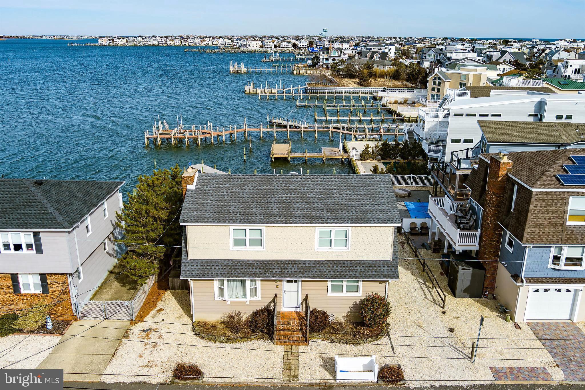 Experience waterfront living at its finest in this beautiful bayfront home featuring 60 feet of direct water frontage. Perfectly positioned to capture serene views and coastal breezes, this property offers both comfort and incredible potential.

This spacious residence includes 5 bedrooms and 2 bathrooms, providing plenty of room for family, guests, or a vacation retreat. Large windows invite natural light throughout the home, while the layout offers flexibility for entertaining or relaxing by the water.

Step outside and enjoy direct access to the bay—ideal for boating, kayaking, fishing, or simply soaking in the peaceful surroundings. With generous frontage, there’s ample space to create your own private waterfront oasis.

Whether you’re looking for a primary residence, seasonal getaway, or investment opportunity, this property is a rare find with endless possibilities.