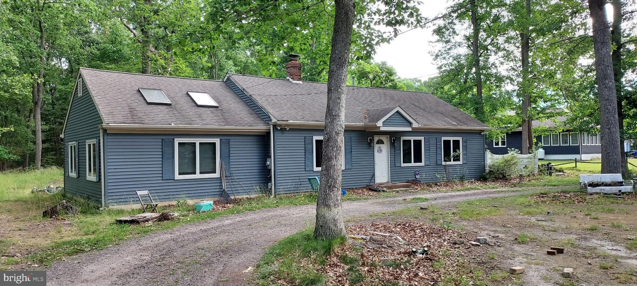 Come, take a look at this cozy home tucked away on a wooded lot.  as you can are there is a brick wall Fireplace with a woodstove. Insert that will heat your entire home.  The kitchen is nicely done with stainless steel appliances   There is a nice size family room with two skylights.  Main Bedroom is secluded on one side of the house.  There is a nice large a lot and a back porch.  Come take a look.