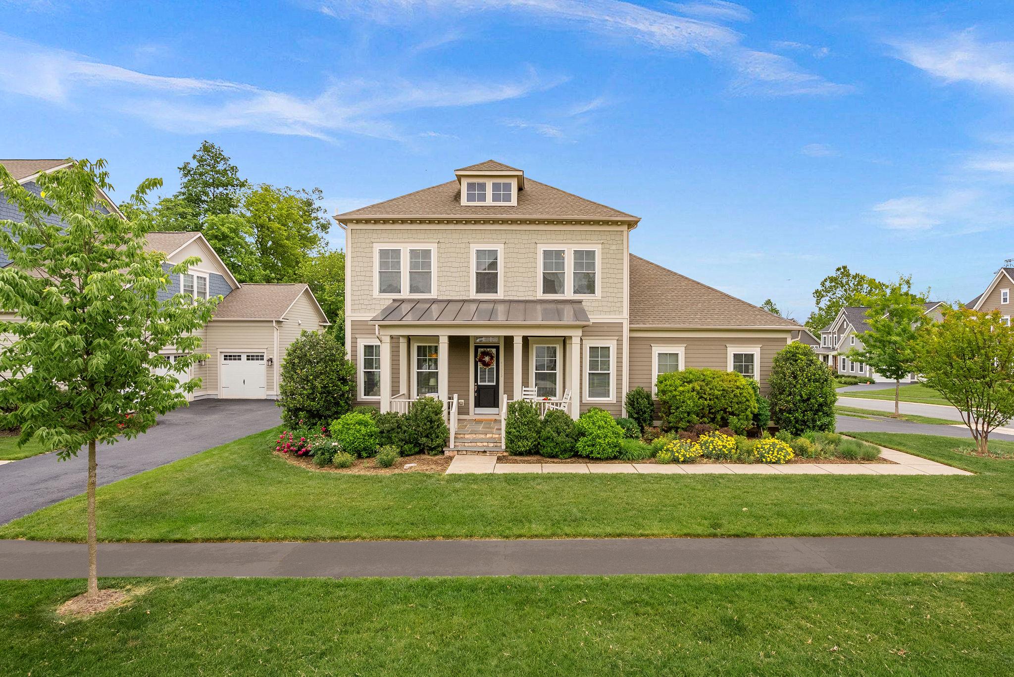 This like new K Hovnanian Craftsman home will have you settling in just in time for summer. With over $130,000 in updates, it's not just a home- it's a lifestyle upgrade! Situated in Willowsford on a premium corner lot backing to conservancy, this one checks all the boxes. One of the rare corner lots that's spacious enough for a 3 car garage. No driveway shuffle! You will feel right at home from the moment you pull up to this beautifully landscaped property. Bonus, this home is tucked inside the community with no through traffic so you can actually enjoy sitting on the front porch and chatting with neighbors.  

Notable updates include: Remodeled powder room, Bosch dishwasher, Zephar Hood, Refrigerator, Tile Backsplash, Hardwood flooring, new upper level carpeting, new garage doors, Built-Ins, Professionally designed landscape and outdoor space, fully fenced yard, buried downspouts and sump pump drain, attic fans in main and garage roof, buried drains, garage floor with epoxy flooring, and so much more!

You will love the timeless style, sun filled spaces, and the kind of everyday functionality that makes life run smoother. Designer lighting, hardwood flooring, custom built-ins, new carpeting and fresh paint make this home move in ready so you don't have the stress of a to-do-list. Inside, expansive living areas are filled with natural light and designed for the way people truly live - open gathering spaces, flexible rooms for work or play, and seamless indoor-outdoor flow. The chef’s kitchen serves as the centerpiece of the home, featuring an oversized island, double oven and hood, premium finishes, abundant cabinetry, and space to entertain, whether hosting holiday dinners or casual evenings with friends. The family room features custom built-ins, a fireplace and a rear bump out that offers plenty of space for family movie night or retreating with your favorite book. There is a home office on the main level that is great for work from home days or to use as a flex space. 

Upstairs, the spacious primary suite feels like a private retreat with a spa-inspired bath and generous walk-in closets, while the additional bedrooms offer comfort and versatility for family, guests, or multigenerational living. Don't miss the walk-in closets and generously sized secondary rooms. An upstairs laundry room with built in cabinets is the ultimate in convenience and functionality. The finished lower level expands the home even further with recreation space, guest suite with walk-in closet and full bath, and an additional unfinished space to create the lifestyle you want.

Outside, enjoy peaceful mornings, evening barbeques, sunset views, and the beautiful street scape that makes Willowsford one of Northern Virginia’s most coveted communities. This home features a professionally designed outdoor space with both a composite deck and oversized patio with fire pit, making it the perfect space to hang out with family and friends. There is even a fully fenced yard adding convenience and privacy. The garden is the perfect spot to decompress after a long week. 

Residents enjoy resort-style amenities including pools, fitness center, farm-to-table lifestyle programming, miles of scenic trails, parks, playgrounds, community events, and access to highly rated Loudoun County schools. This community is truly unique offering something for nature enthusiasts and 5 star resort lovers alike. Perfectly positioned near Ashburn’s dining, shopping, commuter routes, and everyday conveniences, this is more than a home - it’s a lifestyle opportunity that will truly level up your day to day living.