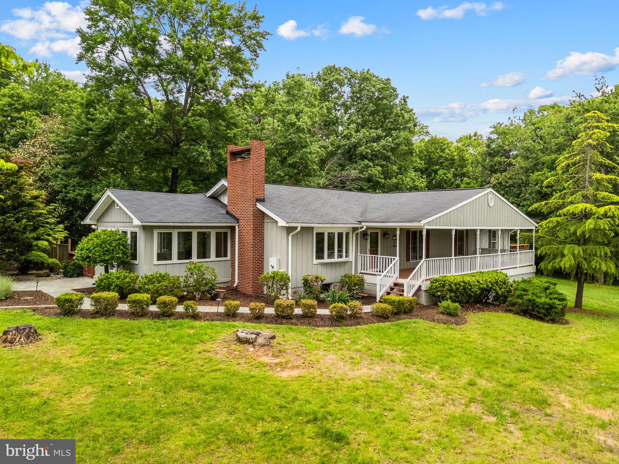 PRICE IMPROVEMENT! Now Offered at $939,900. Seller Offering Up to $10,000 Toward Buyer's Closing Costs (subject to contract terms and lender approval).

Welcome Home to 41726 Stumptown Rd, Leesburg, VA 20176. Nestled on 5.05 private acres, this spacious and versatile property offers the perfect blend of comfort, functionality, and convenience. Boasting over 4,380 finished square feet, this home features 4+ bedrooms and 4 full bathrooms, providing ample space for everyday living and entertaining.

Inside, you’ll find multiple living areas highlighted by two fireplaces and two wood stoves, creating a warm and inviting atmosphere throughout. The expansive layout offers flexibility for multi-generational living, work-from-home setups, or guest accommodations.

Enjoy the outdoors from the large front, side, and rear porches, perfect for relaxing and taking in the scenic surroundings. The property also features an in-ground swimming pool with hot tub, ideal for summer entertaining.

Additional highlights include a detached apartment—perfect for guests, rental income, or private office space—and a 1-car garage.

Conveniently located just minutes from shopping, grocery stores, local amenities, and Dulles International Airport, this property offers peaceful country living without sacrificing accessibility.