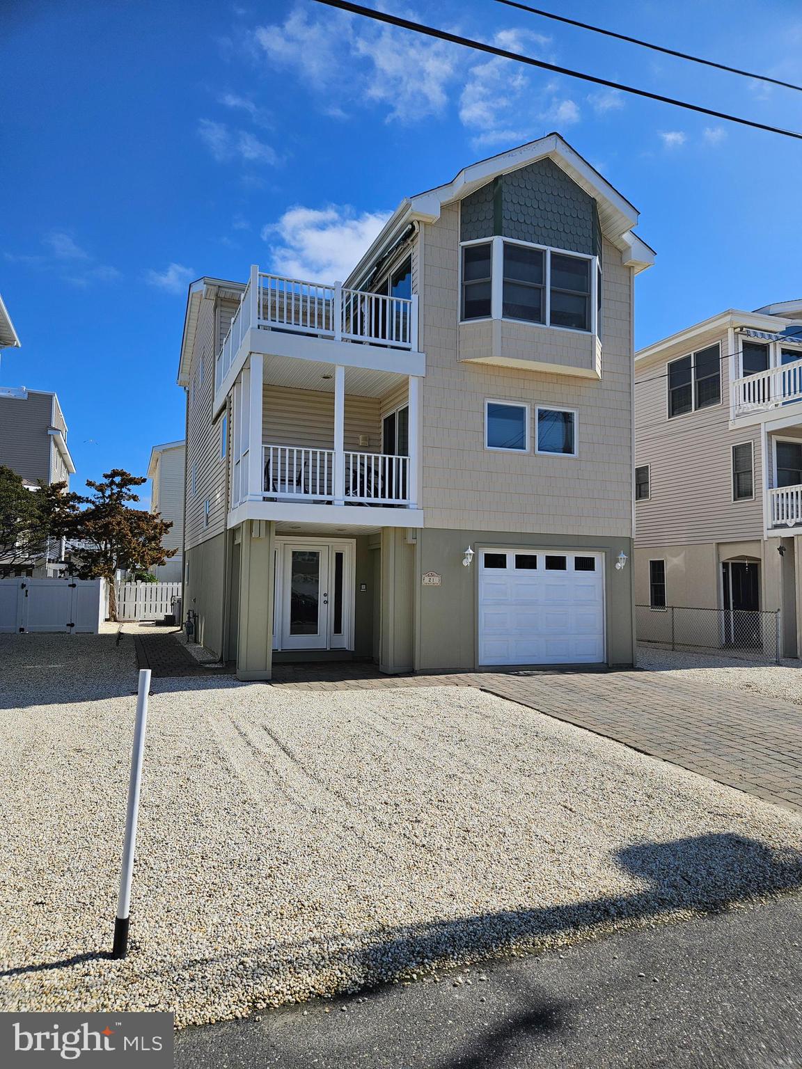 This off-the-bay, beautifully designed contemporary custom-built home is ideally located just a short walk to the beach, offering the perfect blend of coastal luxury and everyday comfort. Thoughtfully crafted with reverse living in mind, the home features four generously sized bedrooms and two-and-a-half baths.

The open-concept main living area is filled with natural light and flows seamlessly onto a spacious deck—perfect for enjoying stunning sunset views. The home includes two fiberglass decks, one of which is equipped with a gas hookup for easy outdoor grilling.

Recent upgrades provide peace of mind, including a newer roof, hot water heater, washer and dryer, and refrigerator. Additional highlights include central air conditioning, a Jacuzzi tub in the main bathroom, and a ground-level hot tub for ultimate relaxation.

Conveniently located within walking distance to shopping, ice cream shops, and all your favorite island attractions, this property offers the ideal coastal lifestyle whether as a primary residence, vacation home, or investment opportunity.