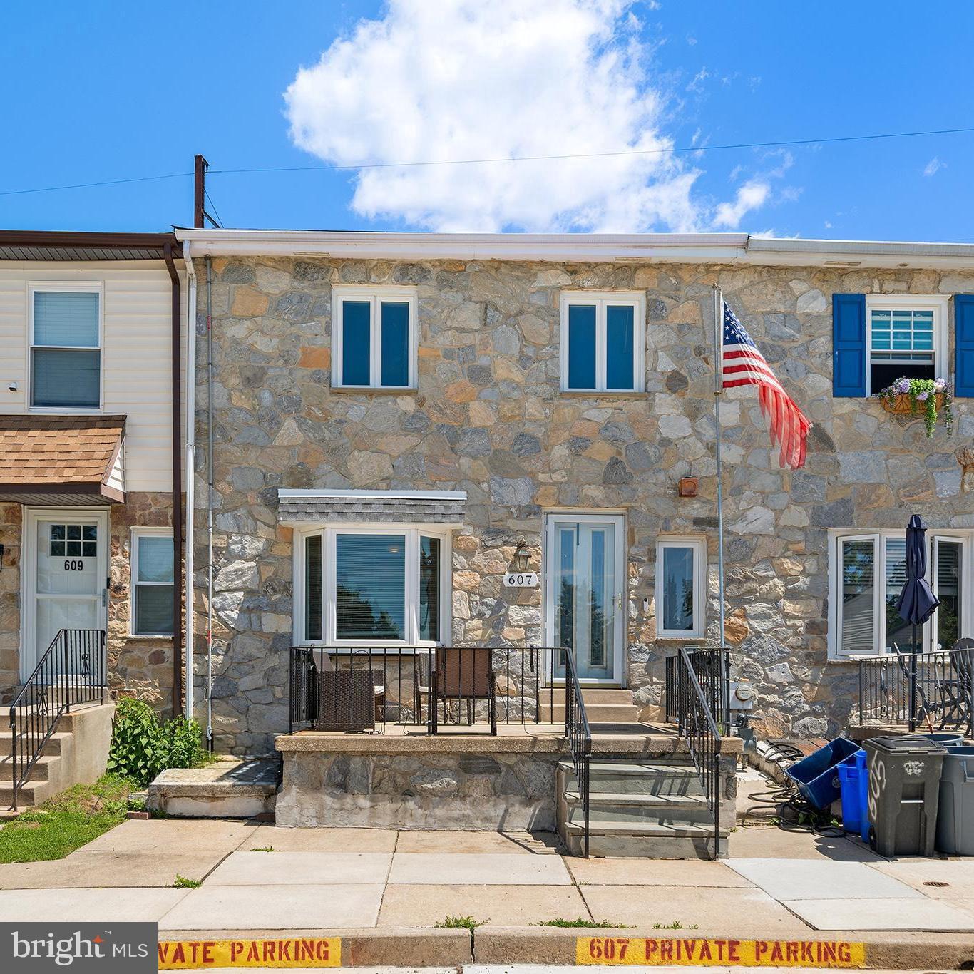 Welcome to 607 Saint Anthony Lane, a beautifully maintained townhouse tucked away on a quiet cul-de-sac in Upper Darby. This spacious home offers two designated parking spaces, a charming front patio, and a thoughtfully designed layout perfect for everyday living and entertaining. The heart of the home is the oversized eat-in kitchen and dining area, featuring abundant cabinet and counter space, making it ideal for hosting family gatherings and holiday celebrations. Large patio doors open wide to invite in fresh air and create a seamless indoor-outdoor flow, while an abundance of natural light fills the main living spaces throughout the day. The living room features hardwood flooring and a cozy electric fireplace, complemented by a convenient first-floor powder room and laundry area. Upstairs, you'll find three generously sized bedrooms, including a primary suite with a private bath, along with an additional full hall bathroom. The finished lower level offers exceptional versatility with a full bathroom, storage area, and direct access to the backyard, making it perfect for a family room, guest suite, home office, playroom, or additional living space. A quaint, manageable backyard, energy-saving solar panels, and pride of ownership throughout make this move-in-ready home a must-see.