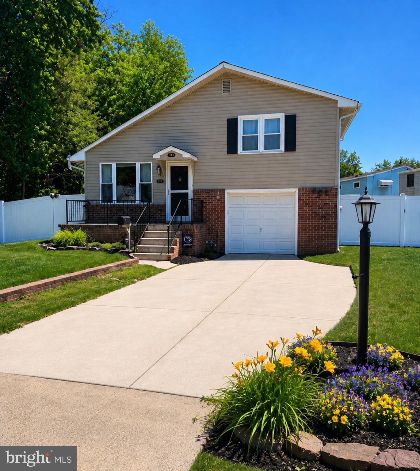 From the moment you arrive, you’ll appreciate the amazing wooded lot, oversized concrete double driveway, and fantastic vinyl privacy fence that frame this beautifully maintained home.
Step inside and be welcomed by an open floor plan filled with warmth and natural light. Hardwood flooring flows throughout the spacious living room and dining area, highlighted by a large bay window. The charming kitchen features beautiful cabinetry, a stainless steel sink, ample counter and storage space, plus a dedicated wine and coffee bar area that adds both function and style.
A door from the kitchen leads to the large fenced backyard, complete with a storage shed and beautiful gardens. Just a few steps down from the kitchen, you’ll find a spacious family room with tasteful ceramic tile flooring, a convenient laundry room, and a powder room with pedestal sink. Sliding glass doors provide 
access to the backyard and stamped concrete patio—perfect for relaxing at the end of the day.
The lower level also offers direct access to the garage, and beyond that, a partial basement with utility sink and abundant storage space.
Upstairs, you’ll find three spacious bedrooms, all with ceiling fans, generous closet space, and hardwood flooring beneath the neutral carpeting. The updated hall bath features ceramic tile, a pedestal sink, and a linen closet.
Conveniently located near shopping, restaurants, and major highways, this truly lovely home is ready for its next owner.
New Roof 2022, New  HWH 2021, New HVAC 2020,  New vinyl fence 2019, 
Whole house generator 2019,
Square footage is based on a previous seller’s appraisal.