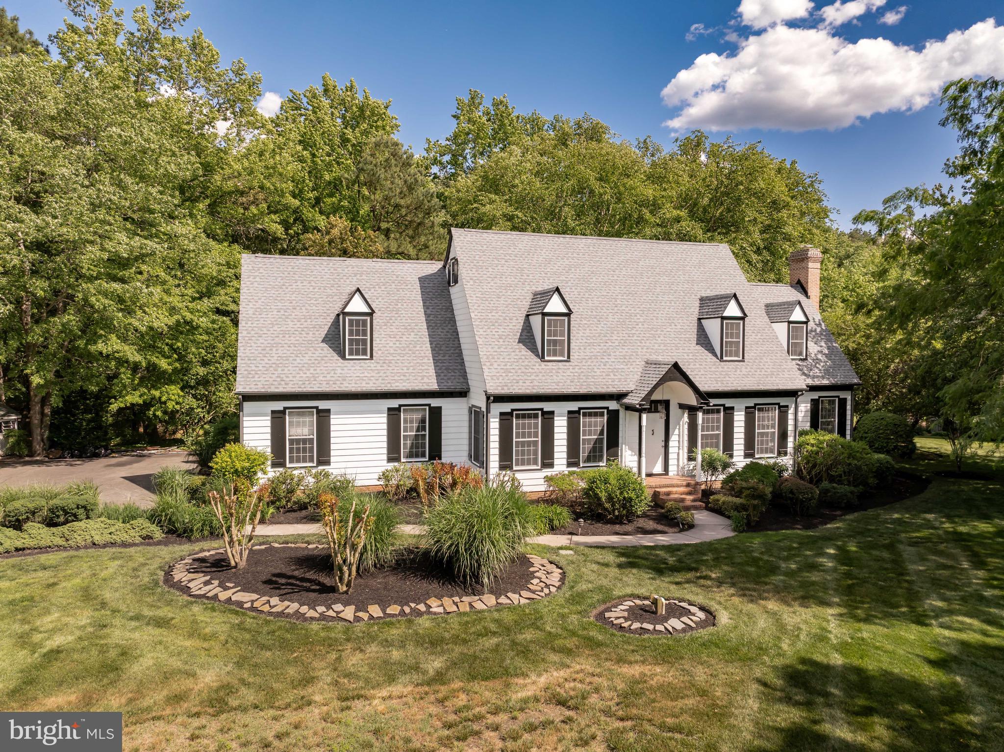 Welcome to this stunning home in the highly sought-after Foxchase community, offering more than 4,000 square feet of beautifully finished living space. Much larger than it appears from the outside, this home combines generous living areas with thoughtful updates and exceptional spaces for both everyday living and entertaining.

The heart of the home is the expansive kitchen, featuring abundant cabinetry and storage, with easy access to the sprawling rear deck overlooking a private, naturally shaded backyard—an ideal setting for outdoor gatherings, cookouts, or quiet evenings surrounded by nature.

Inside, both the living room and family room are anchored by cozy fireplaces, creating warm and inviting spaces to relax with family, friends, or your favorite book. The luxurious primary suite is truly a retreat, offering two distinct living areas that provide endless flexibility for a sitting room, dressing area, home office, or fitness space. Filled with natural light and featuring a private balcony, this serene sanctuary is the perfect place to begin and end each day. The recently renovated primary bath enhances the experience with stylish finishes designed for comfort and relaxation.

Four additional bedrooms offer plenty of space for family and guests, while the beautifully updated guest bath adds both style and convenience. With its impressive size, versatile floor plan, and desirable location, this exceptional Foxchase home is ready to impress. Schedule your private tour today and discover everything it has to offer!