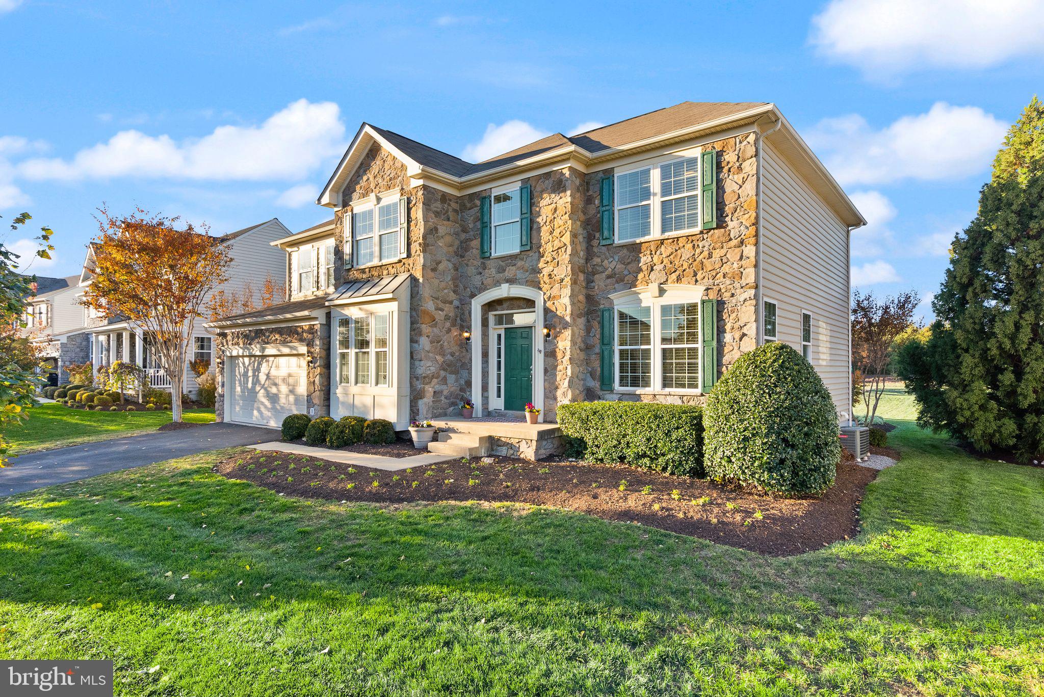 Where everyday living becomes something extraordinary.

From the moment you arrive, the stately stone façade sets the tone: timeless, confident, and undeniably inviting. Step inside, and the atmosphere shifts to something more intimate—sunlight cascading through a soaring two-story foyer, illuminating a space that feels both grand and deeply livable.

At the center of it all, a newly reimagined kitchen commands attention. Designed with a curator’s eye, it pairs clean-lined surfaces with soft, modern finishes, while sculptural chandeliers cast a warm, ambient glow as day turns to evening. Just beyond, the sun-drenched morning room becomes a daily indulgence—coffee in hand, light pouring in, time slowing down.

Every space has intention. The front sitting room offers a quiet, refined escape. The family room, anchored by a gas fireplace and enhanced with surround sound, becomes the stage for effortless entertaining or indulgent nights in. A private main-level office creates a seamless blend of productivity and calm, complemented by a discreetly placed powder room for guests.

Upstairs, five beautifully proportioned bedrooms and three full baths offer a sense of retreat for every member of the household. The owner’s suite is nothing short of a sanctuary—elevated by a tray ceiling, a private sitting area, and a spa-inspired bath that feels lifted from the pages of a design editorial. A soaking tub, frameless glass shower, and organic, modern finishes come together to create a space that restores as much as it impresses. Even the upper-level laundry room is thoughtfully placed—because true luxury lives in the details.

The walk-up lower level extends the experience even further: a generous recreation space, a private guest suite with full bath, and expansive unfinished storage ready to evolve with your lifestyle.

And then—there’s the outdoors.

Set on one of the largest lots in the community, this nearly half-acre unfolds into a rare, flat expanse of possibility. A stone patio invites long evenings under open skies, while the thoughtfully designed landscape and playful touches create a setting that feels both elevated and alive.

With a two-zone HVAC system, a spacious two-car garage with an additional refrigerator, and a home meticulously maintained, every element has been considered.

This is not just a residence—it’s a feeling.
A seamless blend of sophistication and comfort.
A place where luxury is lived, not just admired.