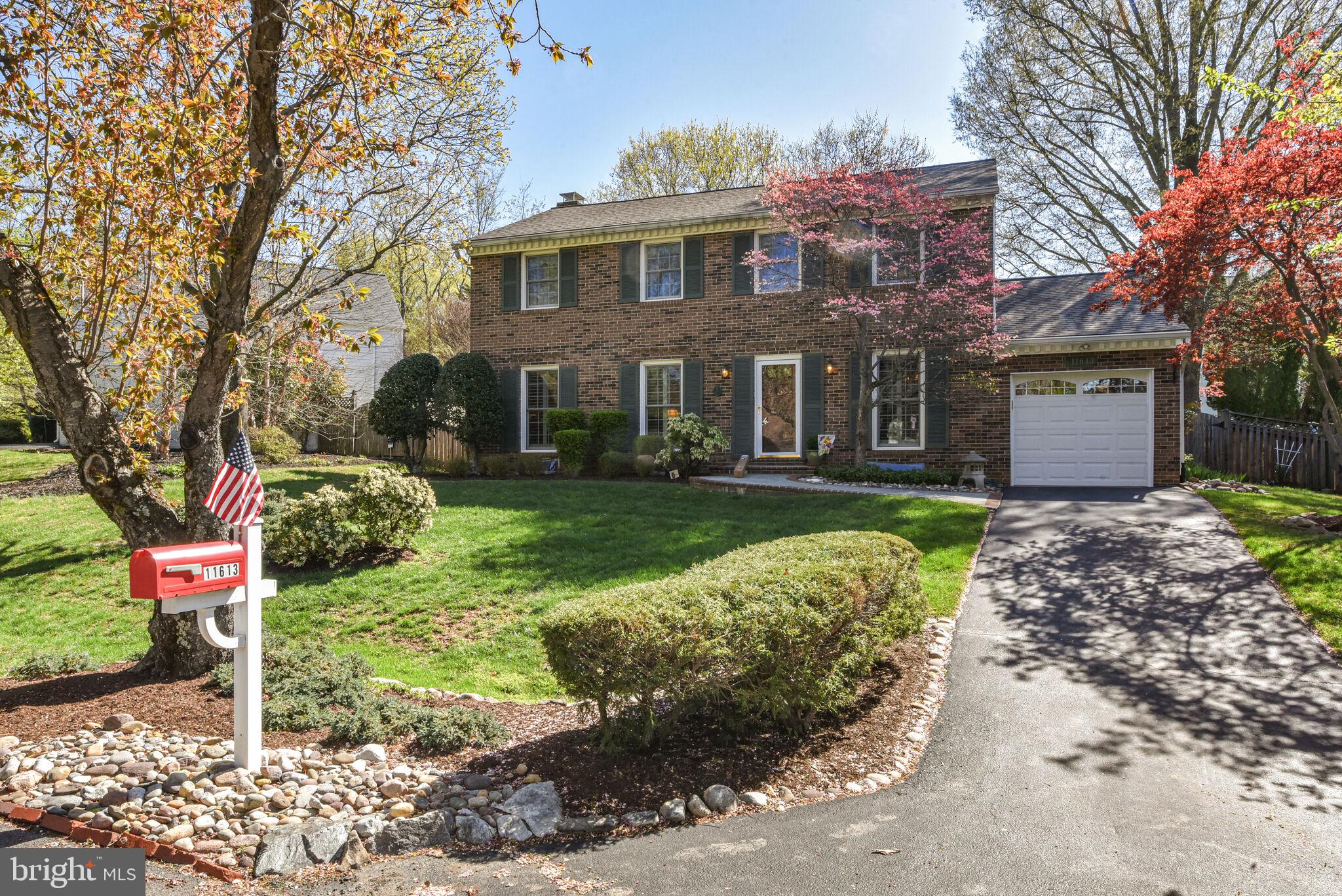 Welcome to this meticulously maintained Center Hall Colonial, where classic elegance meets modern comfort. The main level features stunning wood floors that flow seamlessly throughout. The spacious living room is complemented by oversized Anderson windows with tasteful plantation shutters, which also grace the formal dining room, enhancing its charm. The heart of this home is its beautiful kitchen, boasting Silestone countertops, stainless steel appliances, and custom solid cherry cabinetry, including a stylish glass-front cabinet. The kitchen opens up to a warm and inviting family room with a cozy brick-surround fireplace, built-in shelving, and plantation shutters. Enjoy your morning coffee in the breakfast nook or step through the sliding glass door to the deck and backyard, perfect for entertaining. Conveniently located off the kitchen, the laundry room, equipped with built-in shelving, provides access to both the garage and the backyard. Upstairs, discover four generously sized bedrooms, including a primary suite that offers a walk-in closet with custom organizers and a renovated dressing area. All bedrooms are carpeted, with hardwood flooring beneath the carpet. The en suite bathroom features quartz-topped vanities and marble flooring. The hall bath showcases a shower/tub combination, porcelain tile flooring, and a quartz-topped vanity. The renovated lower level is an entertainer's dream, featuring LVP flooring, a wet bar with granite counters and a wine refrigerator, recessed lighting, and a bonus room with a built-in workbench, currently serving as an office or workspace. Additionally, there is a large walk-in cedar closet for ample storage. Pull-down attics on both the bedroom level and the garage provide additional storage space. Step outside to the crown jewel of this property -- a beautifully landscaped yard with a large deck, complete with built-in bench seating and a pergola, perfect for outdoor gatherings and relaxation. This home is a true gem, offering a blend of sophistication and comfort. Conveniently located just off Falls Road, this home is just a short distance to 270, 495 and Potomac Village. The Country Glen Swim & Tennis Club is less than 1 mile away.