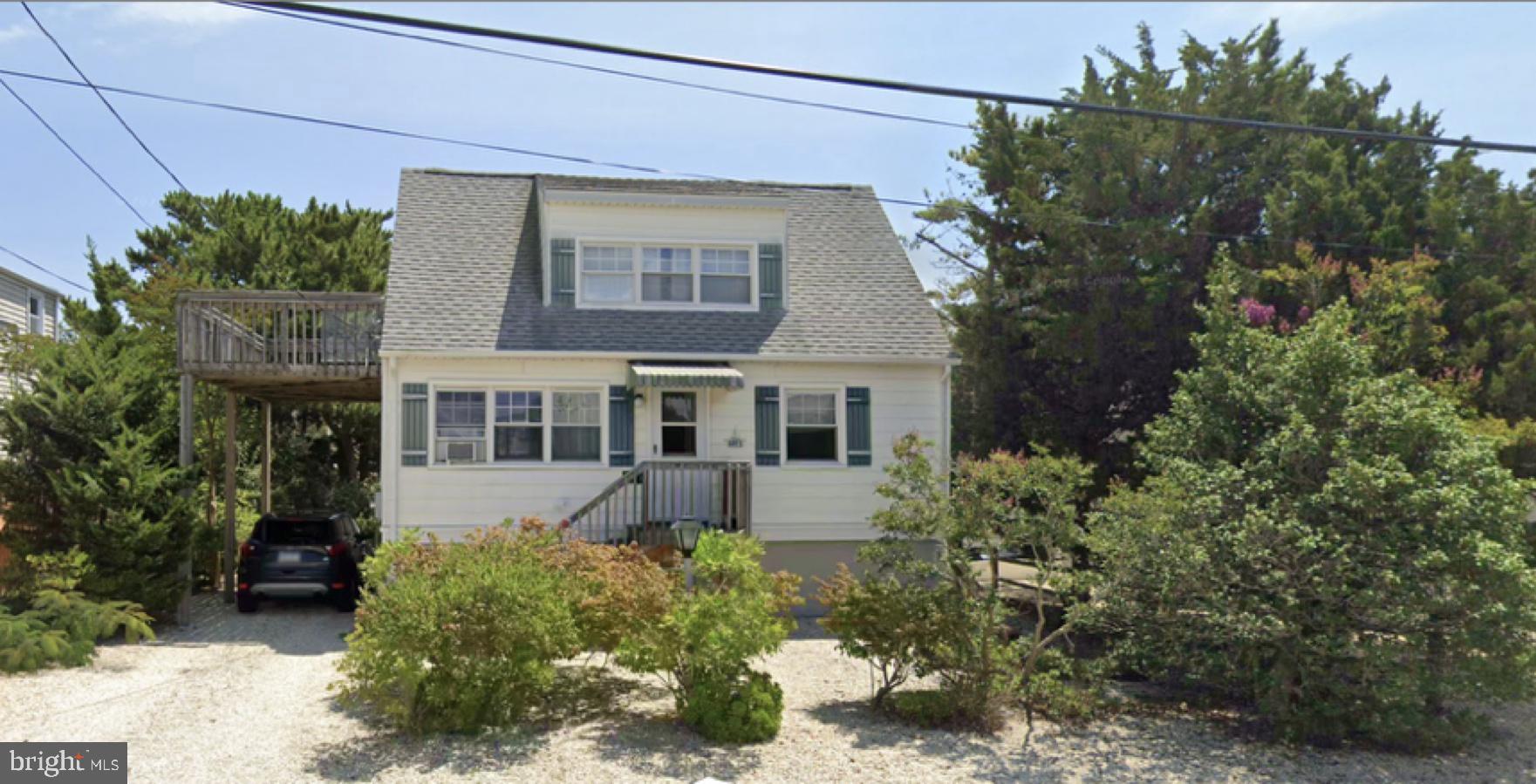 Classic LBI charm meets smart investment potential just in time for summer!
These timeless LBI Capes are becoming few and far between, preserving  ‘The way LBI used to be’ . This home is now waiting for its next owner to build lasting memories.  Step into this authentic Brant Beach classic—perfect for your first time LBI buyer or savvy investor.  From its reimagined Knotty-pine-paneled walls to the open, airy first floor living space there is something for everyone here.  The large open floor plan makes an exciting canvas for a new owner.  Located in the highly sought Brant Beach Yacht Club neighborhood this 2/3-bedroom  beach house sits on an expansive 50 by 100’  lot. A huge backyard with easy serene biking and walking along scenic Bayview ave.  Enjoy an open living area downstairs, a spacious second-floor sleeping area with access to 2nd floor deck, and modern comforts like tankless hot water and baseboard heat. Raised after Sandy with room to grow—this one’s ready for your personal touch..  Whether putting your personal touches on the existing home, remodeling or building new you have the lot & location to make summer dreams come true.   An addition or new construction would provide great water views and endless sunsets!    With many options to add value, grow together or start new, you wont want to miss this opportunity to own a piece of magic LBI!  Come see this today and begin working your summer canvas!