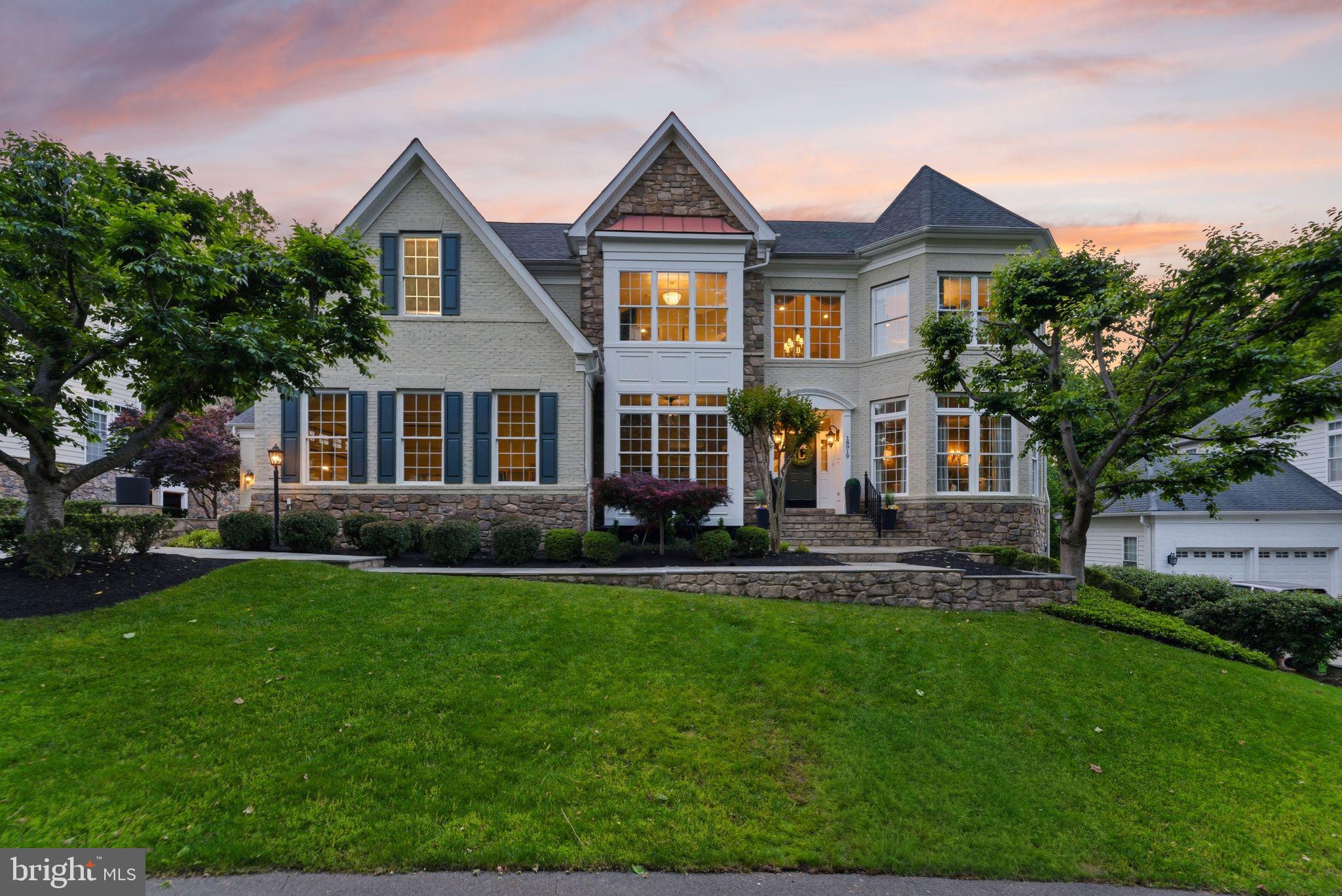 Open House Sunday May 31st 2pm to 4pm**Premium Lansdowne Living on Goose Creek. Positioned at the end of a cul-de-sac on one of the most coveted streets of Lansdowne on the Potomac, this sought-after Van Metre Knoll model sits on a third-acre lot backing to mature tree privacy and the creek itself, with west-facing sunsets off the back of the home and a private pathway leading from the yard down to hiking trails and a canoe and kayak launch. Enjoy a four-car garage, grand-scale rooms, and designer-level updates throughout. Inside, a two-story foyer opens to sweeping stairs, a private home office, and a sunlit formal living room. The adjoining formal dining room offers flexibility for entertaining or everyday use, with elegant moldings, updated lighting, and a flowing floor plan that carries through the main level. An updated butler’s pantry leads into a fully renovated chef’s kitchen, showcasing gleaming white cabinetry and countertops, quality stainless appliances, abundant storage, and a generous island built for casual meals and conversation. The vaulted sunroom just beyond opens directly to the deck for an easy indoor-outdoor flow, with wooded views in every direction. The family room continues the open layout, with a fireplace and three soaring arch-topped windows. Two updated powder baths sit conveniently near the front entry and mudroom. Upstairs, rich hardwoods give way to new carpet in the private quarters. The primary suite occupies its own private wing with tray ceilings, a sitting area, dual walk-in closets, and a spa-style bath featuring a jetted soaking tub, passthrough shower, and double vanities. An adjoining bedroom works beautifully as a nursery, office, or yoga space and connects through a Jack-and-Jill bath to a third bedroom. Two more upper bedrooms share their own updated Jack-and-Jill bath. The lower level walks out to the patio and features a gorgeous renovated rec room with high-end LVP chevron flooring, designer lighting, and a fully equipped bar. This level also hosts a home theater room, a bonus room, a full bath, and a large bedroom with walk-in closet and full windows for a true guest or multigenerational suite. Outside, the fenced backyard offers multiple patio spaces, a covered area for shade, and a fire pit, all set against a lawn that backs into the trees. The expansive deck off the main level is built for grilling and gathering above the canopy. Recent improvements include the remodeled kitchen (2023), full basement renovation and new water heater and sump pump (2021), new HVAC with warranty through 2029 (2024), reimagined outdoor spaces with new deck, patio, fence, fire pit, and walkway stairs (2022), main-level flooring, mudroom built-ins, and basement media room (2017), washer and dryer (2020), dishwasher (2021), yard irrigation, refreshed bathrooms with new paint, lighting, sinks, hardware, and toilets, custom light fixtures throughout, and over twenty newly planted trees with custom flower beds. Lansdowne amenities include indoor and outdoor pools, a fitness center, playgrounds, sport courts, aerobics rooms, a ballroom, business center, and more, with Riverside High, Belmont Middle, the community playground, and tennis and pickleball courts all close by. Route 7, Lansdowne Town Center, the Golf Club at Lansdowne, Lansdowne Resort and Spa, One Loudoun, and Bazil Newman Riverfront Park are all within easy reach. A rare combination of privacy, scale, and a very special location, in one of Northern Virginia’s most distinguished communities.