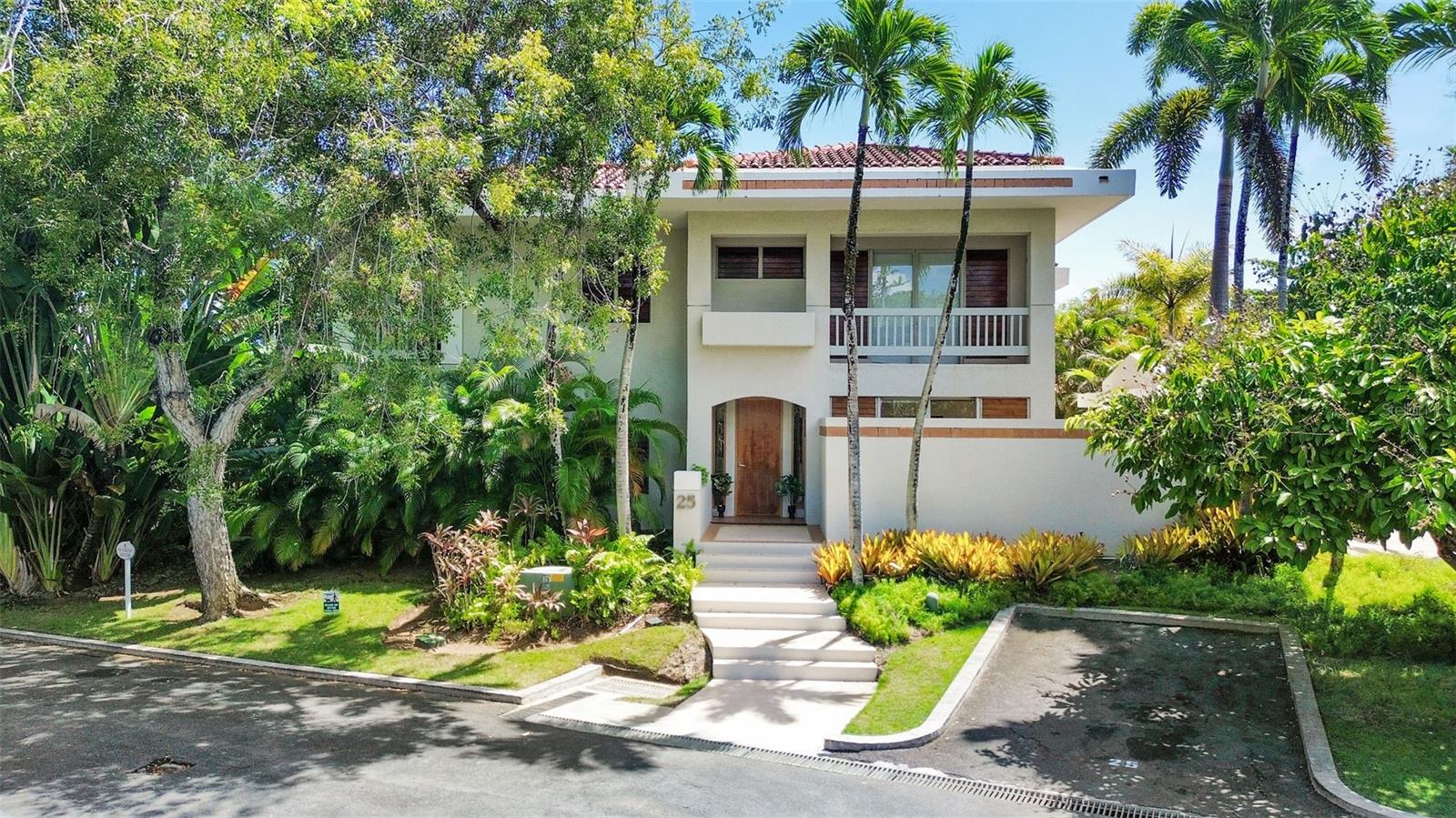 Discover an exceptional opportunity to enjoy the Dorado Beach Resort & Club lifestyle in this inviting two-story residence located within the exclusive Fairways community. Surrounded by lush tropical landscaping, this home offers approximately 3,202 total square feet, including 2,930 interior square feet, with 3 bedrooms, 3 full bathrooms, and 1 powder room.

The thoughtfully designed floor plan features a convenient first-floor bedroom with an en-suite bathroom, while the primary suite and an additional bedroom are privately situated upstairs. Bright and spacious living and dining areas, abundant natural light, and a seamless connection to the outdoors. The fully equipped kitchen features contemporary cabinetry, generous counter space, and a central island ideal for everyday living and entertaining.

The primary suite offers a peaceful retreat with a private covered balcony overlooking tropical greenery. Its spacious bathroom features double vanities and a soaking tub beautifully illuminated by a skylight. Multiple terraces and balconies create inviting spaces to relax and enjoy the Caribbean breeze.

Additional conveniences include two parking spaces, a community backup generator, water heater, and water filtration system.

Fairways residents enjoy their own community swimming pool and tennis courts, along with convenient golf-cart access to the Beach Club. As a residential community within Dorado Beach Resort & Club, Fairways offers the opportunity to enjoy resort club membership and its exceptional lifestyle amenities, subject to applicable membership requirements.

Furniture is negotiable. Currently tenant-occupied. Showings anticipated to begin in November 2026, by appointment.