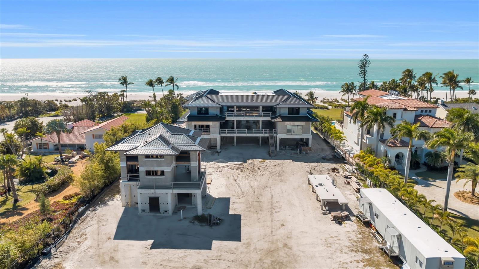 Under Construction. Set on nearly two private Gulf-front acres, this visionary estate is emerging as one of the most architecturally significant residences ever conceived on Longboat Key. Designed by the internationally acclaimed firm Sweet Sparkman Architecture & Interiors, the home represents a rare convergence of sculptural design, coastal sensitivity, and modern livability. Bold in concept yet timeless in execution, the main residence unfolds with intention. A dramatic foyer introduces expansive living spaces designed to capture light, scale, and uninterrupted Gulf views. The primary suite is conceived as a private sanctuary, complete with dual spa-inspired baths and bespoke dressing rooms. A stately office, refined lounge, formal dining room, and temperature-controlled wine cellar complement the open-concept great room, which transitions seamlessly to a sweeping Gulf-front terrace. Dual kitchens, a showpiece entertaining kitchen and a separate chef’s kitchen, elevate both daily living and grand-scale hosting. The estate continues upward to a rooftop deck with panoramic coastal vistas, while other levels offer a private cinema, multiple guest suites, and a dedicated guest-level kitchenette. A thoughtfully designed guest house and separate pool house provide additional privacy and flexibility for extended stays or staff accommodations. Outdoors, the setting transforms into a private coastal resort. Lush, layered landscaping surrounds a dramatic resort-style pool and spa, expansive entertaining terraces, tranquil water features, and potential for a private tennis and pickleball court — all oriented toward the Gulf’s endless horizon. Positioned along one of the most coveted stretches of Longboat Key, the property offers both seclusion and proximity to the best of the region, including The Resort at Longboat Key Club, The St. Regis Longboat Key Resort, St. Armand's Circle, and the cultural vibrancy of downtown Sarasota. With construction advancing and pricing evolving accordingly, this is a rare opportunity to secure a generational Gulf-front legacy estate at a pivotal stage. Longboat Key’s global recognition, including its inclusion among Forbes Travel Guide’s Top 12 Destinations, further underscores the enduring value of this extraordinary offering.