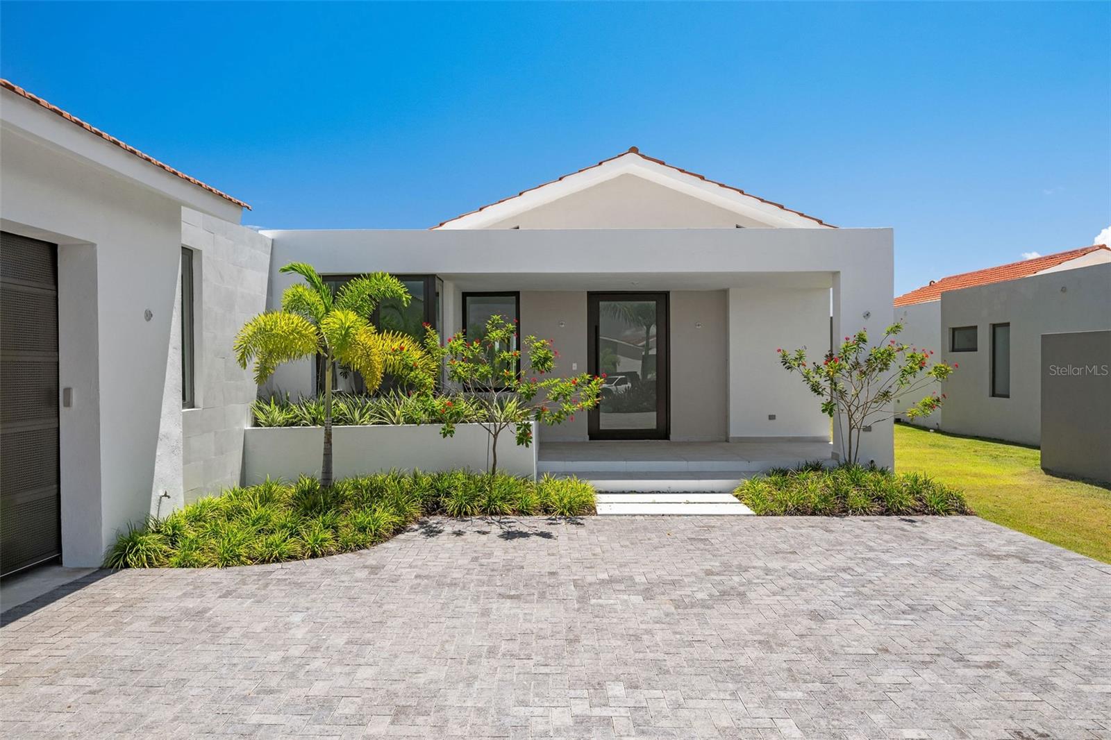 Welcome to this stunning, brand new home priced at $2,900,000, offering unparalleled luxury and space. With a generous 5,500 square feet of living area and set on a 1,150-square-meter lot, this exceptional property is designed to offer the perfect combination of comfort and style.
Features Include:
• 5 spacious bedrooms and 5.5 beautifully appointed bathrooms.
• Expansive living spaces, including a living room, family room, dining room, and breakfast room, perfect for entertaining.
• A gourmet kitchen with a large island and premium quartz countertops, ideal for culinary enthusiasts.
• A serene, rooftop terrace providing outdoor living space with sweeping views.
• A large backyard, offering plenty of space for relaxation and recreation.
• Double carport with a flush-panel garage door, golf cart parking, and additional storage.
Luxury Finishes and Inclusions:
• Rectangular ceramic floor tiles throughout the home, with anti-slip outdoor floor tiles and modern shower tiles in the bathrooms.
• Sleek, white bathroom and laundry appliances, coupled with laminated wood cabinets featuring soft-closing systems and stylish moldings.
• Fixed glass in the master bathroom and full glass continental windows, sliders, and doors with aluminum keep-safe glass for both elegance and safety.
• A grand solid wood entrance door, and semi-solid cedar wood interior doors that add warmth and charm.
• Custom closet systems in laminated wood, and cedar wood slats in the pantry for functional yet luxurious storage.
• The home is pre-fitted for a solar heater, mini-split units, cistern, power generator, smart home appliances, and photovoltaic panels for eco-friendly living.
This home is designed for the modern family, with attention to detail in every room. Spacious backyard and a flush-panel garage door complement the sleek, contemporary aesthetic of this property.
Live in style and comfort, with top-of-the-line finishes and smart home features that are sure to impress.