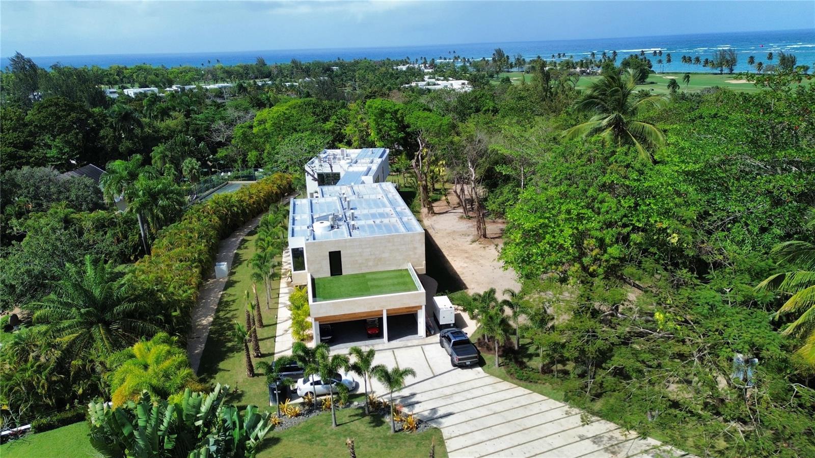 Introducing Villa Escondida, a newly constructed luxury residence on an exceptional 1.3-acre lot in Villa Dorado Estates, where the land is as compelling as the home itself.

The expansive lot offers a rare level of flexibility in Dorado Beach, with ample space to create your own private estate experience. Envision a private tennis court, pickleball court, larger resort-style pool, detached casita, outdoor sports area, additional entertaining spaces, or a combination of them all. The possibilities are uniquely open-ended.

The two-story residence offers 13,273 sq. ft. of total construction, including 9,069 sq. ft. of interior space, with soaring high ceilings, six ensuite bedrooms, and a spacious primary suite with an expanded custom closet. Multiple terraces, a covered porch, open-air living spaces, and a balcony extend the home into its tropical surroundings.

The existing grounds feature a private swimming pool, pool bath, landscaped grounds, fully fenced yard, and private cold plunge for a wellness-focused lifestyle, while the scale of the property leaves room to expand and create something truly your own.

Just minutes from the beach, amenities, dining, golf, and resort lifestyle, Villa Escondida offers a rare combination of new construction, exceptional scale, soaring interiors, and the freedom to shape an estate around the way you want to live.