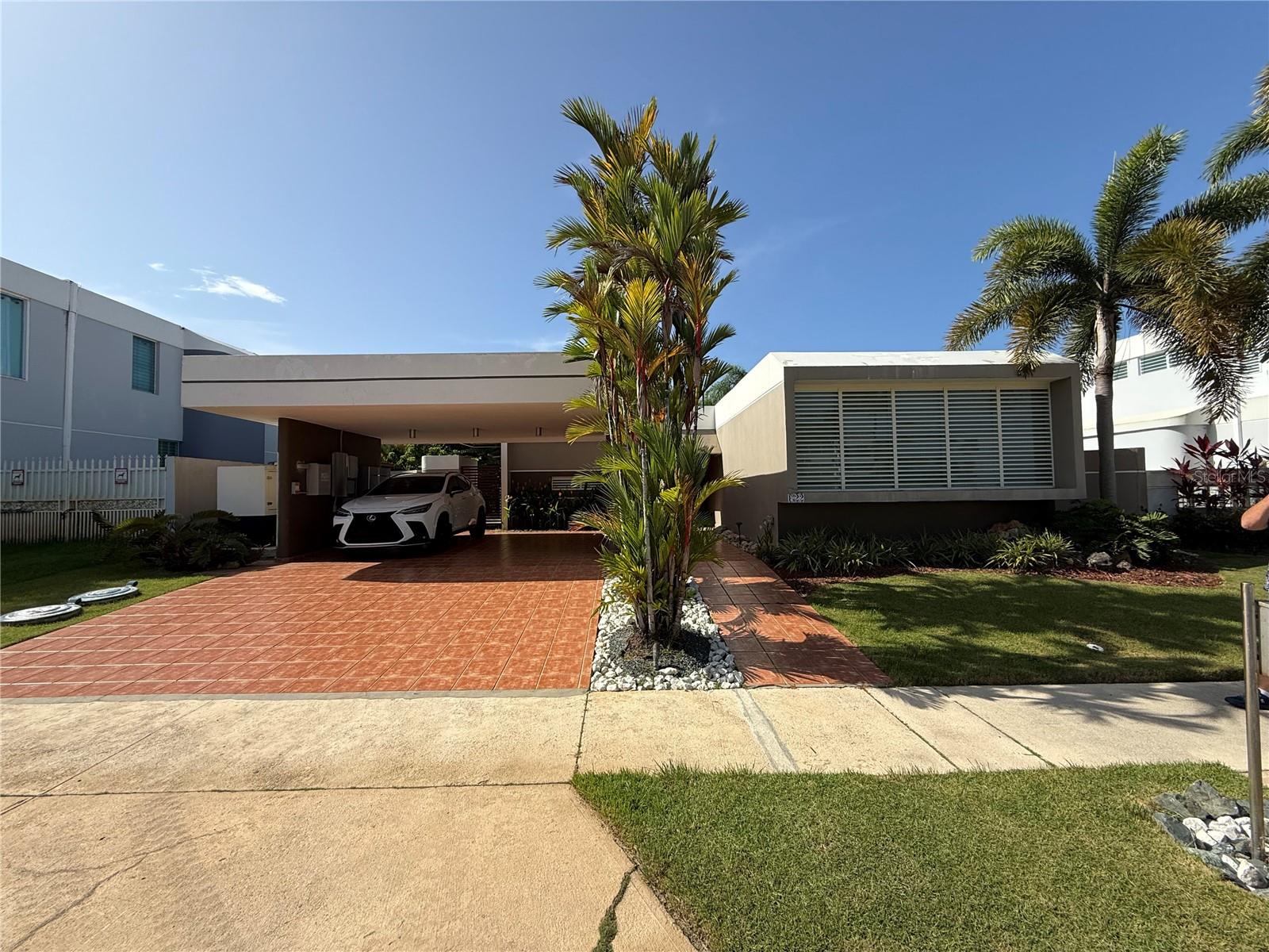 Discover this charming home in the sought-after gated community of Paseo Real in Dorado. This residence offers 3 bedrooms and 2 bathrooms, with the master bathroom beautifully remodeled and extended for added comfort. The open-concept layout seamlessly connects the family, living, and dining areas to a well-appointed kitchen, creating an inviting space for everyday living and entertaining. Step outside to enjoy a covered terrace, a private garden, and a dedicated BBQ area — perfect for hosting friends and family. The property is equipped with an Enphase 20 kW solar panel system, a  600 gallons water cistern, a solar water heater with 2 panels, a gas stove, and hurricane-proof Marva windows for efficiency and security. Community amenities include a gazebo, swimming pool, tennis and basketball courts, and a playground. Ideally located a short walk to supermarkets, restaurants, hospitals, doctors’ offices, a movie theater, and more, this home offers both comfort and convenience in a prime Dorado location.