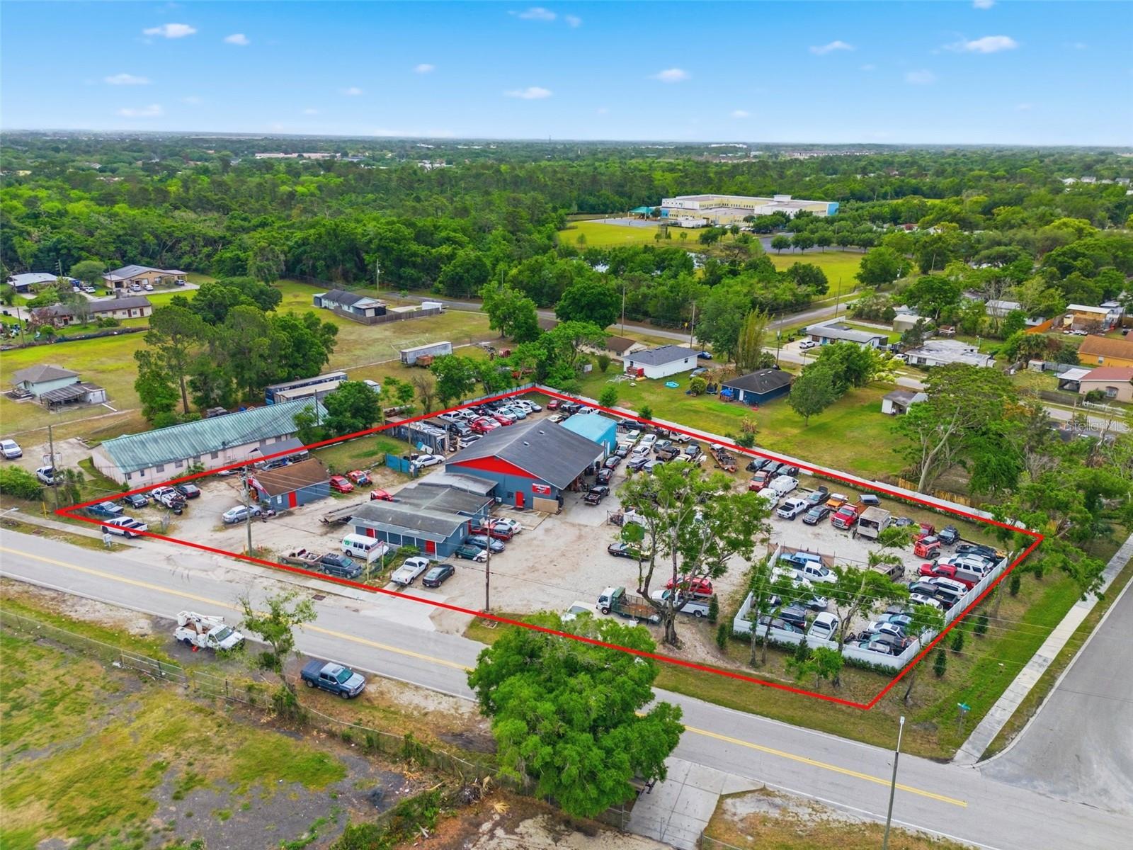 Turnkey Auto Shop & Towing Business + Real Estate | FHP-Approved Operator | Operating Since 2000

Presenting a rare opportunity to acquire a fully integrated auto shop and towing business along with the underlying real estate in the Orlando, Florida market. This offering combines a proven operating business with a strategically positioned automotive facility, delivering both immediate operational continuity and long-term asset value.

Ownership has operated at this location since 2000, establishing deep-rooted market presence, customer relationships, and operational continuity. The towing division is Florida Highway Patrol (FHP) approved (Troup D) and has maintained 8 years of continuous service as an authorized tow provider, representing a significant barrier to entry and a valuable institutional relationship.

The business reflects historical operating performance supported by available financial documentation. The operation includes existing equipment, infrastructure, and an established customer base, providing a foundation for continued operations under new ownership.

The real estate component is supported by comparable automotive property sales within the Orlando market, providing a strong underlying asset foundation. The property includes existing month-to-month occupants generating supplemental income while preserving flexibility for future leasing or operational strategies.

Includes both the business and real estate, along with an additional 0.51-acre lot, bringing the total to 1.38 acres, allowing for immediate takeover and continued operations.

This opportunity provides a compelling combination of operational scale, recurring service demand, and real estate ownership, making it well-suited for operators, investors, or groups seeking expansion within a high-demand service sector.

Investment Highlights:
FHP-Approved Tow Operator (8 Years) – Established relationship with Florida Highway Patrol; strong barrier to entry

Operating at Location Since 2000 – Long-term presence with established reputation and customer base

Turnkey Auto Shop & Towing Business – Immediate operational continuity with existing systems and infrastructure

Real Estate + Business Included – Acquire both operations and the underlying asset in one transaction

Established Customer Base & Demand – Recurring service needs within a high-traffic market

Supplemental Income (~$27,000 AGI) – In-place month-to-month tenants providing additional revenue

Functional Automotive Facility – Infrastructure suited for continued automotive use

High Barrier-to-Entry Industry – Licensing, relationships, and operational scale limit new competition

Scalable Platform – Opportunity to expand towing fleet, services, or operational efficiency