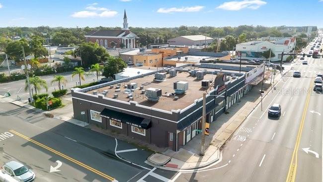 Exceptional owner-user or investment opportunity in the heart of Orlando's highly sought-after Mills 50 District. This freestanding 8,188± SF commercial building sits on a prominent signalized corner at E Colonial Drive and N Thornton Avenue with outstanding visibility, strong traffic counts, and AC-1/T zoning that allows for a variety of commercial uses. Recently renovated with approximately $1.5 million in improvements, the property features high-end interior finishes, an expansive open layout, commercial kitchen infrastructure, ample on-site parking, and excellent frontage along one of Orlando's busiest commercial corridors. Ideal for restaurant, medical, retail, showroom, office, entertainment, or redevelopment opportunities. Conveniently located minutes from Downtown Orlando, Ivanhoe Village, Baldwin Park, Winter Park, and major transportation corridors.