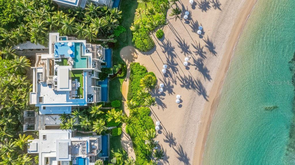 Spanning 11,000 square feet of refined oceanfront living, Penthouse West Beach is a one-of-a-kind residence offering exclusive access to two private floors within the West Beach Residences at Dorado Beach, a Ritz-Carlton Reserve. Set along Rockefeller's pristine handcrafted beach, this extraordinary penthouse delivers an unparalleled coastal living experience. 

The residence combines Penthouse 3141 and 3142 on the lower level, crowned above by The Summit, a full-floor rooftop retreat, creating a rare two-level penthouse estate with exceptional privacy and scale. 

Expansive terraces and floor-to-ceiling glass doors frame uninterrupted ocean views, seamlessly blending indoor elegance with the surrounding natural beauty. The primary suite serves as a tranquil oceanfront retreat with a spa-inspired bath, outdoor shower, private jacuzzi, and dedicated massage area. Three additional master suites feature ensuite baths and private balconies overlooking the sea. A gourmet kitchen with custom European cabinetry anchors the open-concept living spaces, designed for both entertaining and relaxed everyday living. 

At the top of the residence, The Summit offers a spectacular rooftop oasis featuring an L-shaped infinity pool, outdoor kitchen with professional Kalamazoo barbecue, dining terrace, and lounge areas surrounded by lush greenery and panoramic ocean views. 

Residents enjoy access to the world-class amenities of Dorado Beach, a Ritz-Carlton Reserve, including dining at COA Restaurant and Encanto Beach Club Bar & Grill, the renowned Spa Botanico, championship golf courses designed by Robert Trent Jones Sr. and Robert Trent Jones Jr., tennis and pickleball courts, and miles of scenic nature trails along Rockefeller's coastline. 

Also available for lease.