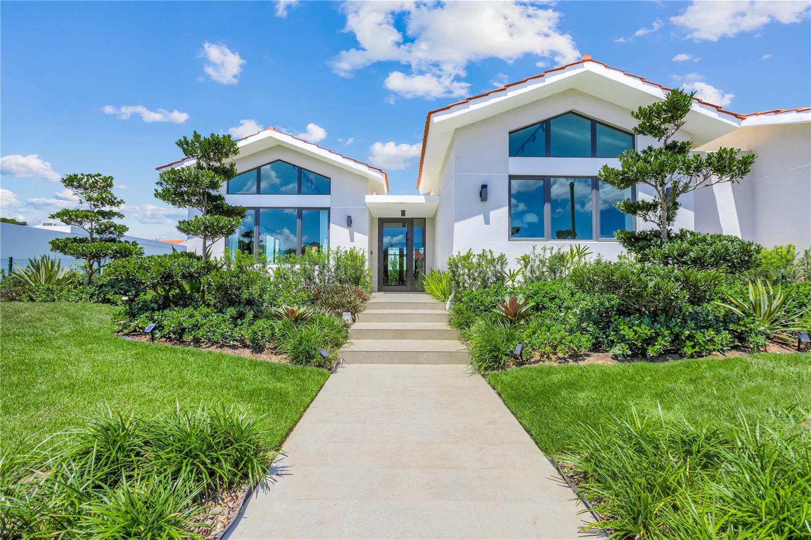 Located in Sabanera de Dorado, this residence is situated at Calle Anturios 765 in Isla de las Flores. It features a carefully designed landscaped garden that makes this property unique. The home is offered fully furnished, decorated, and move-in ready. It sits on a 10,763 sq ft lot (999.9 m² / 0.247 cuerdas).

This is a single-level floor plan with approximately 4,000 sq ft of living space. It features 4 bedrooms, all equipped with closet organizers, a studio/office, and 4.5 bathrooms. The master suite includes a walk-in closet and ensuite bath. The kitchen, which includes a pantry, opens to the dining and family areas. The layout is completed by a family room, a gallery, and a covered terrace.

The property includes a two-car carport with storage, all kitchen appliances, 8 A/C units, security cameras, and a modern lighting system. It is equipped with a solar water heater, a water cistern, and a 30kW electric generator strategically located at the rear of the house. A concrete side fence provides additional privacy.

The TASIS Dorado School is located within the gates. Residents have access to a clubhouse with pools, a fitness center, and sports courts. The surroundings include lakes, jogging and biking trails, and green spaces. The area features 24/7 gated security.

HOA:$390/month