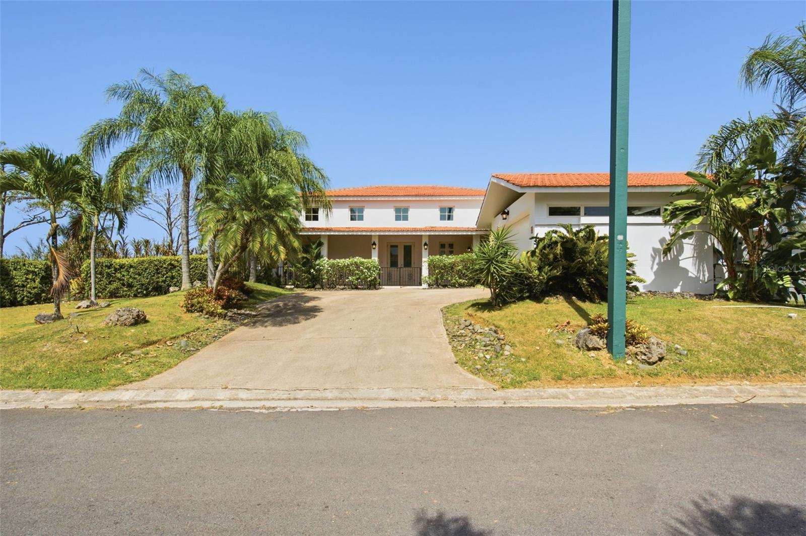 Rare opportunity in Sabanera Dorado: the sought-after Casona Carbia model, no longer in production and rarely available. Set on an 11,881 sq. ft. corner lot at the end of a quiet cul-de-sac, this 4,500 sq. ft. residence offers 4 bedrooms plus a flex room easily converted into a 5th bedroom, giving you 5-bedroom flexibility with lake views, something no other home in Sabanera offers under $2.5M. The home features 3.5 bathrooms, a closed 2-car garage, and a spacious private patio overlooking the lake. Meticulously maintained in its original condition, this home is a true blank canvas. Bring your architect and design it to your exact taste, without paying a premium for someone else's renovation choices or undoing finishes you never wanted. Better yet, a complete architectural transformation concept has already been approved by the HOA board (renderings included), giving buyers a ready-to-execute vision. The property includes two backup generators, a cistern, washer and dryer, and Ring security access. Enjoy convenient access with a 5 minute walk to kids' parks, recreational facilities, shopping centers, and restaurants, all just a golf cart ride away from Doctor's Center Hospital Orlando Health. Proven rental history for investors. Schedule your private showing today.