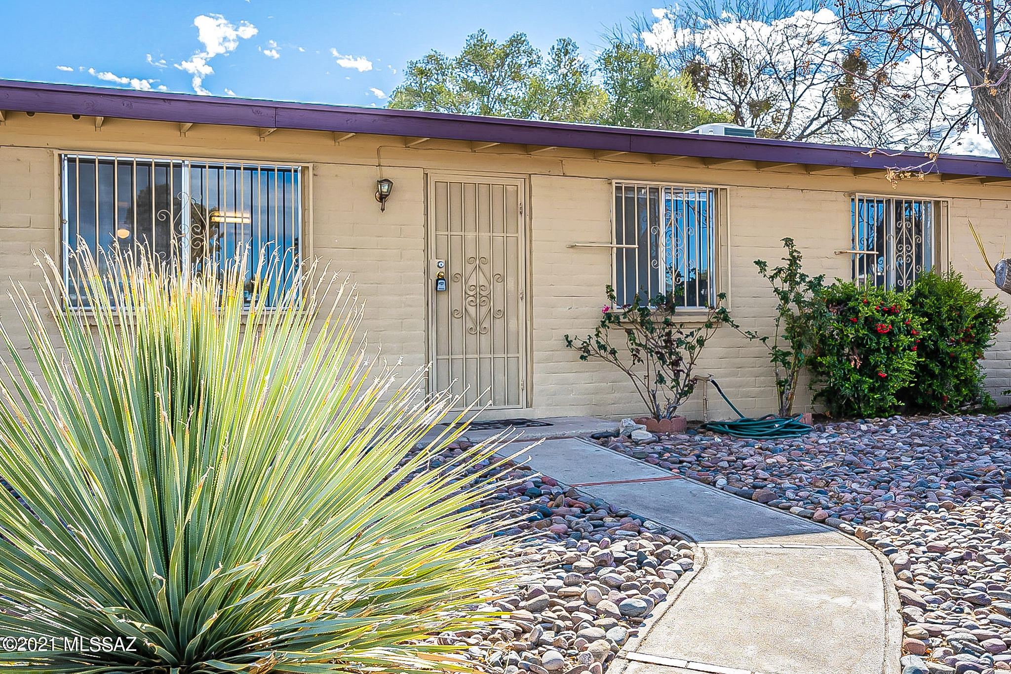 Calling all buyers! This great home on Tucson's East Side is waiting for you to make it your own. This home boasts 3 bedrooms and 1 bathroom, sitting in 982 sq ft. 1 car garage provides nice covered parking. You may be thinking to yourself that the garage may end up just as another storage area but WAIT... there's more! On the opposite side of the house sits a huge storage room/workshop, not included in the square footage, that is perfect for all hobbyist. Sitting on a nicely situated lot on this tucked away street, the property has .22 acres with huge backyard, mature trees with ample shade. Close to DMAFB, Pima College East, short walk to Lincoln Park, Santa Rita High School, easy commute to I10... the list goes on. Come quick because this baby will not last long!