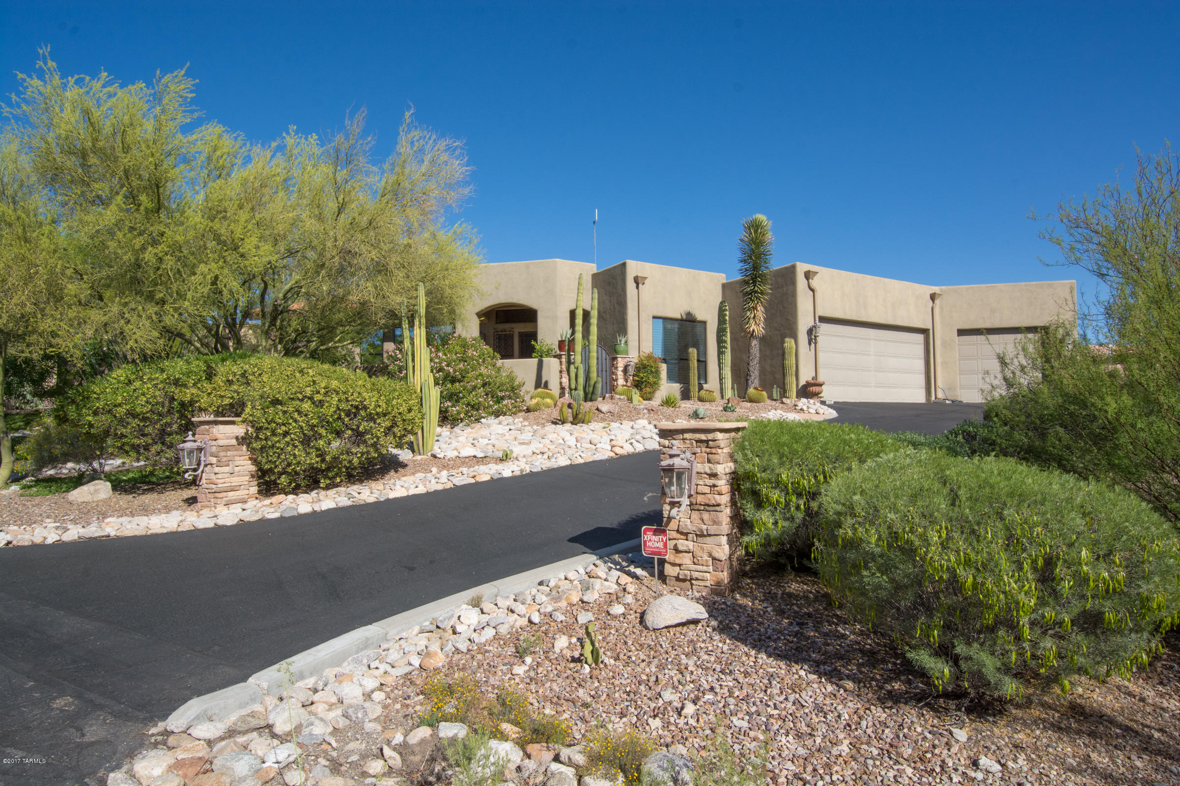 This truly special Foothills home with stunning mountain views from inside and out has an endless list of features that makes this a must-see home. From the gorgeous kitchen with alder cabinets, exquisite granite, Stainless Steel Jenn-Air appliances and Miele DW, to the spacious greatroom with dramatic Cantera fireplace and 18' Italian porcelain floors. The Zen-like master bath features a Kohler Sok overflow tub, onyx mosaic detail, travertine floors, double sinks, granite counters & designer lighting. Outside you will find a newer luxurious pool, a Talavera built-in  BBQ and entertaining area with lush lawn. In the 2nd yard, a kiva fireplace, hot tub & and lovely brick pavers. All this with a 3-car garage, large storage room and on a cul-de-sac lot! See attached list for other features.