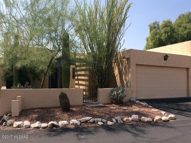 This beautiful town home is located in the heart of the Foothills. It features breathtaking views, covered brick patio, a community pool, detached 2 car garage, and hard wood flooring throughout. This home also features an extra room which can be used as a den or an extra bedroom. The patio has the most amazing views, perfect for enjoying the views early in the morning while drinking coffee or just to unwind in the afternoons. The refrigerator, washer, and dryer are included. Trash service is also included. This home can be rented for 12 months or longer.