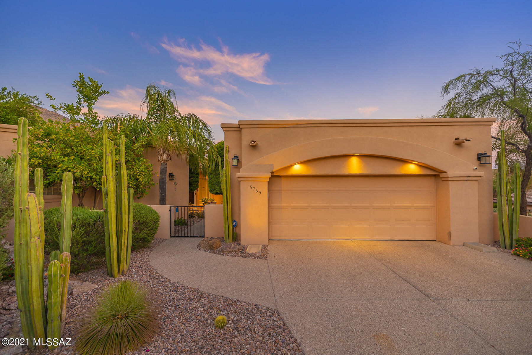 Nestled in the private enclave of The Citadel within the gated community of Finisterra on elevated lot, this stunning 3052-sq. ft. contemporary retreat offers 3 bed/3 bath w/ den. Enter home thru foyer, leading to spacious living room w/ vaulted ceilings, gas FP, & wall of glass showcasing spectacular views of Catalina Mountains. Chef's kitchen w/ granite countertops, upgraded appliances, elegant cabinets, & generous formal dining area w/ off-kitchen breakfast nook. Spacious Master Suite features walk-in closet & Master Bath w/ double vanity, tub, & separate shower. Beautifully designed Den w/ built-in Alder wood desk/cabinets/shelves & private access to patio. Backyard/patio w/ built-in BBQ & breathtaking views at every turn. Clubhouse offers Olympic-size heated pool, spa, & tennis courts