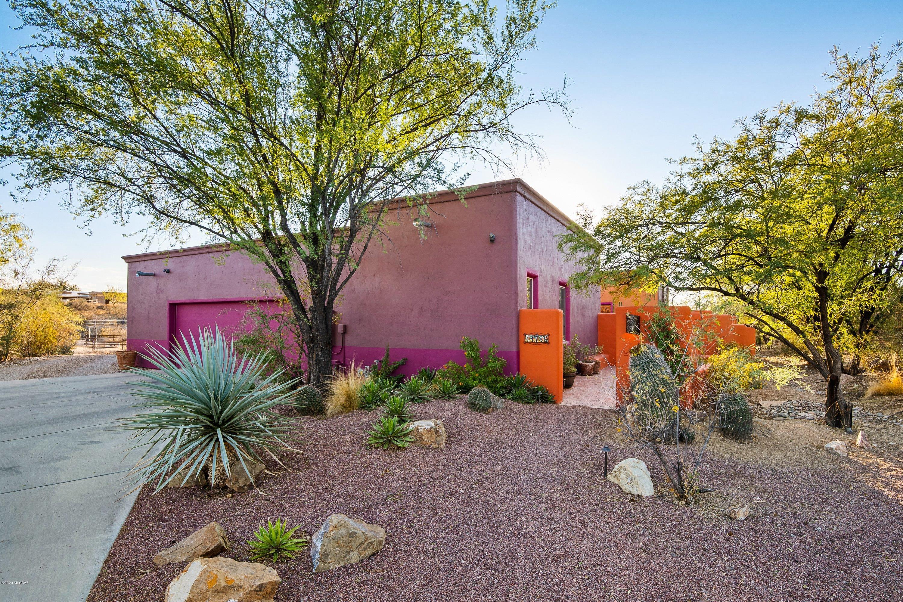 Custom hacienda style rammed earth home on private 3.38 acres with horse facilities and gorgeous pool! Beautiful courtyard landscaped w/ wrought iron doors, fireplace, fountain, landscaping, pavers. Main house 2BR/2BA + study/den. Plaster walls/concrete floors/surr sound/gas fireplace/10 & 12ft ceilings. Kitchen showcases knotty alder cabinets, travertine backsplash, sandblasted granite, 6 burner double oven & walk in pantry. Master walk-in shower w/ imported travertine tile. Outdoor shower. Guest studio w/ 1BR/1BA. Pool w/ new solar heat, landscaping, pavers, lighting, wrought iron fencing. Storage shed, tack room/barn, large turnout, 3 horse stalls, round pen. Room for trailer, RV boat AND toys! Owner licensed to sell Real Estate  in the states of WA and AZ.