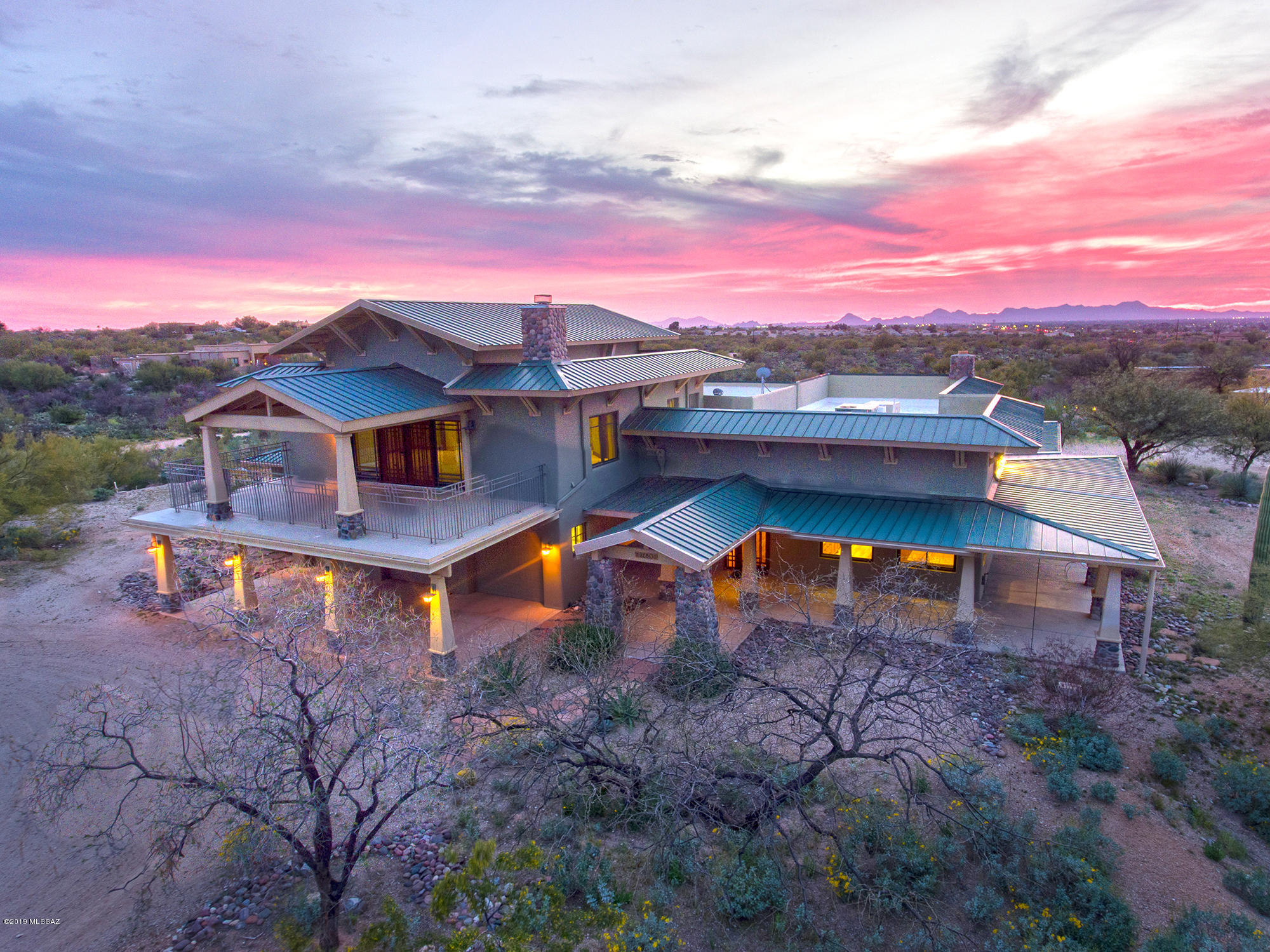 Craftsmanship abounds in this warm & inviting 4.5 acre East side estate! Extensively expanded & timelessly remodeled in 2002. Currently a 3BR home w/ an office that could easily be turned into 4th BR. Attached 3 car garage & detached 2 car garage. Multiple rainwater storage tanks including two 2,500 gallon tanks in front & two 2,500 gallon tanks in rear. Great walking paths, a wrap around porch & amazing mountain views! Master bedroom fireplace made with Ernest Batchelder tile from early 20th Century Arts and Craft tile. The mantel is antique quarter sawn oak from a Texan home. Woodwork in entry way, wall cabinets, kitchen cabinets and beams are quarter sawn white oak, a feature that can be found in turn of the Century Arts & Crafts style homes. Truly a must see home! In the Spring, the tank water usually lasts until beginning of June. In the Fall, it lasts until beginning of December.