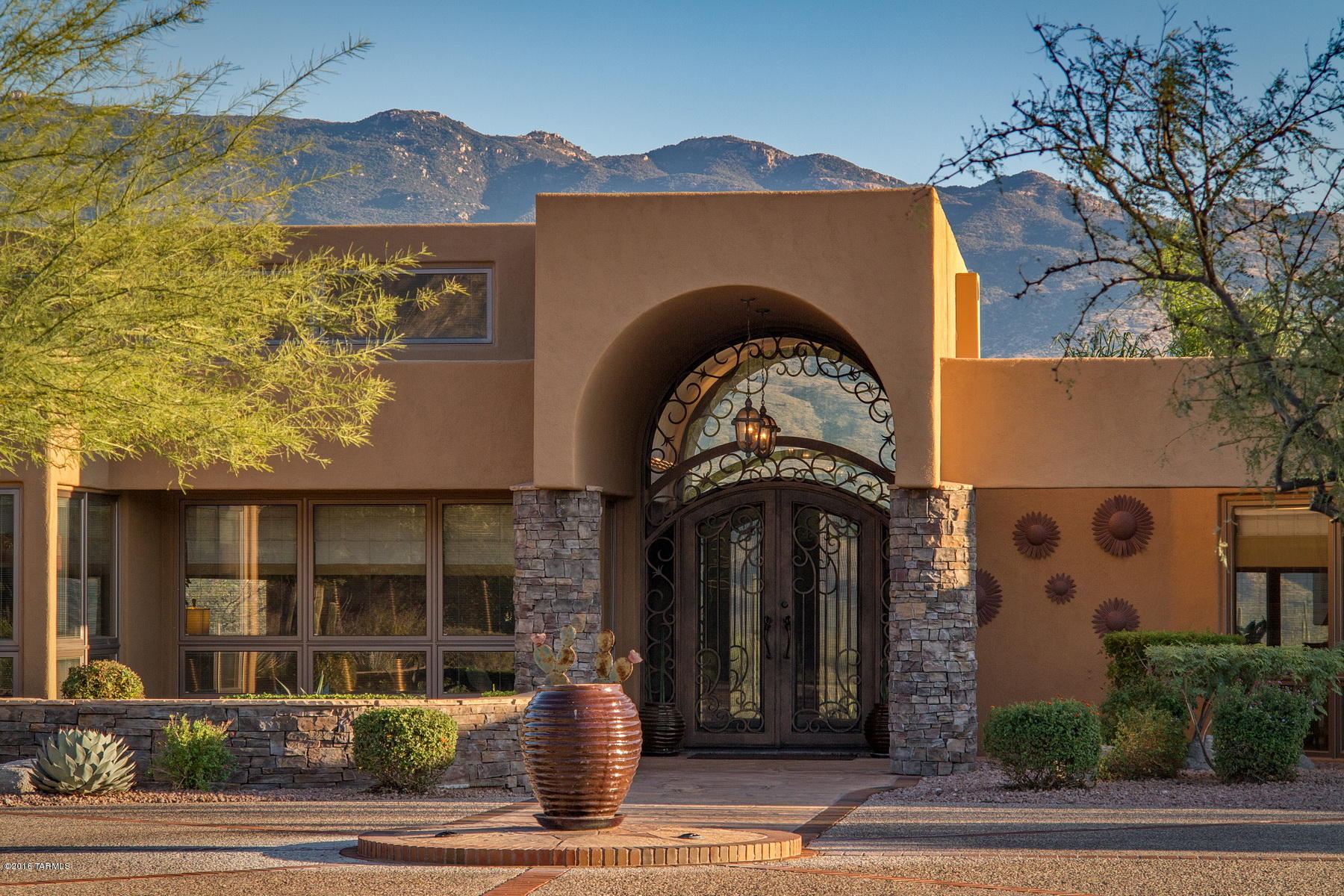 Surrounded by the Catalina Mountains to the North and the Rincon Mountains to the East, this amazing       home on 3.3 acres in a luxury gated community  offers you serenity, quiet, and privacy. Architect designed in 1985, the current owners have upgraded and embellished the home with beautiful finishes and care both inside and out. This is Arizona living at its best with fantastic indoor and outdoor living spaces and 2 enclosed patios where indoors and outdoors come together. Enjoy the rolling hills, wonderful mountain views, desert terrain and vegetation, soaring hawks, spectacular sunrises,   and brilliant sunsets. This is a truly outstanding property in a fabulous community adjacent to the National Forest. See Improvements in the documents under the Detail tab on this listing.