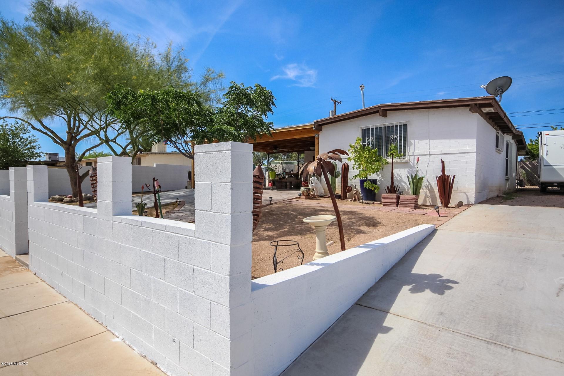 Charming ranch style home in a great Tucson location! Lovely open floor plan with tile flooring and custom paint tones throughout. Kitchen opens to the dining area and boasts stainless steel appliances, custom cabinets, and ample counter space. Three bedrooms, two bathrooms, Extended covered patio overlooks the generous backyard! This home is ready for your personal touches!