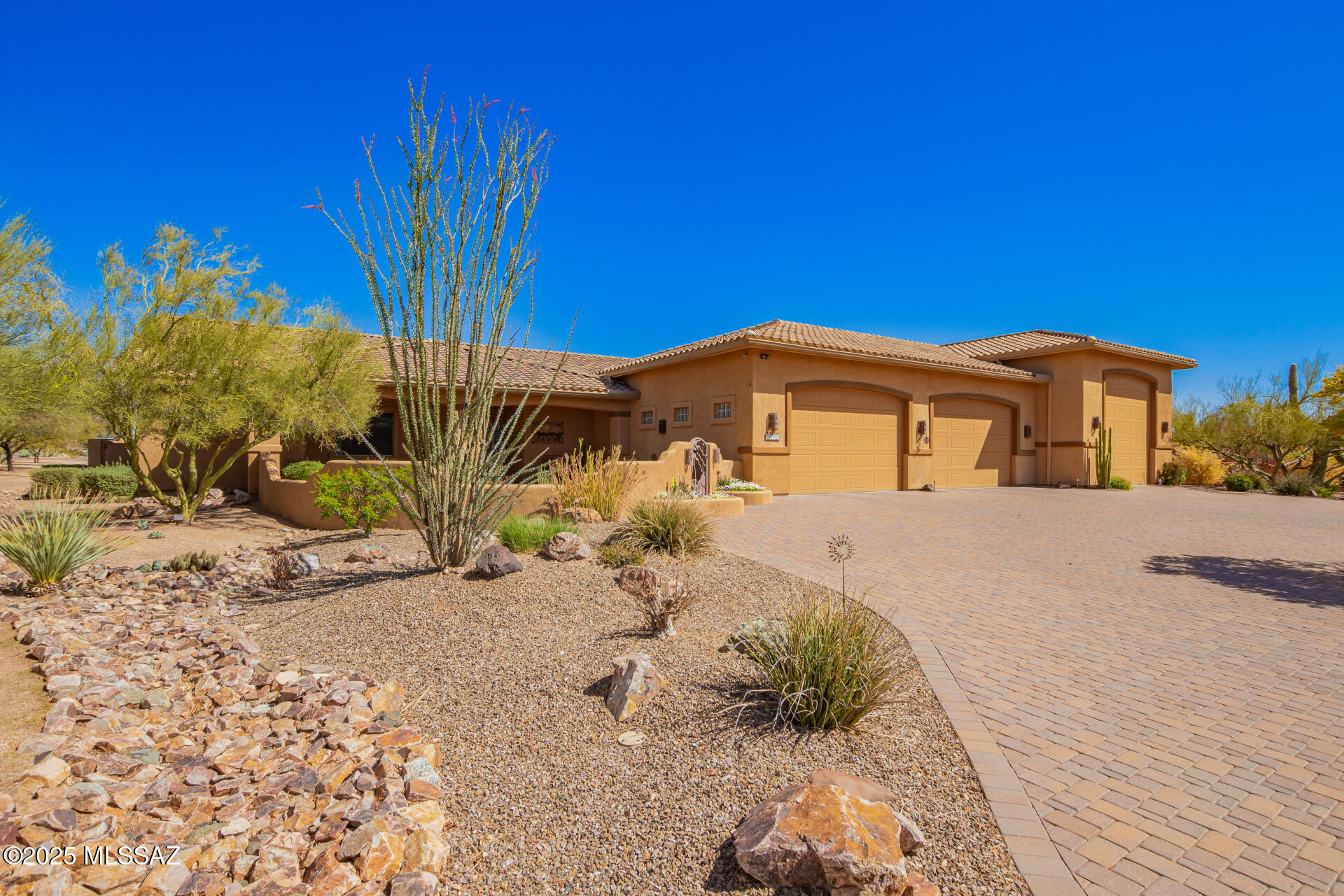 Discover a stunning and thoughtfully designed CUSTOM home on nearly an acre lot with NO HOA in the rarely available neighborhood of Chula Vista/Casa Adobes! This home has ALL of the mountain VIEWS one could hope for and much more! Spanning nearly 3,000 square feet, this home showcases soaring ceilings, paver circular driveway, custom built-ins with electrical and a split floor plan. This remarkable home features a luxurious primary suite with an expansive closet, dual vanities, walk in tile shower and private toilet room. The additional 3 guest bedrooms are complemented by large walk-in closets and 2 updated bathrooms as well as a 1/2 bath in the garage. The gourmet kitchen boasts granite countertops, breakfast bar seating with a prep island and stainless-steel built-in appliances. Check out the walk-in pantry and laundry room before making your way to the EXPANSIVE 4 car extended length garage PLUS an over height RV garage with electric hook ups, plenty of room for all the toys and MORE! You will then find sweeping mountain views from your backyard oasis, complete with a sparkling pool, paver patio and easy-care desert landscape all on automatic sprinkler system, perfect to entertain year-round! Homes in this neighborhood are a rare find and will not last!