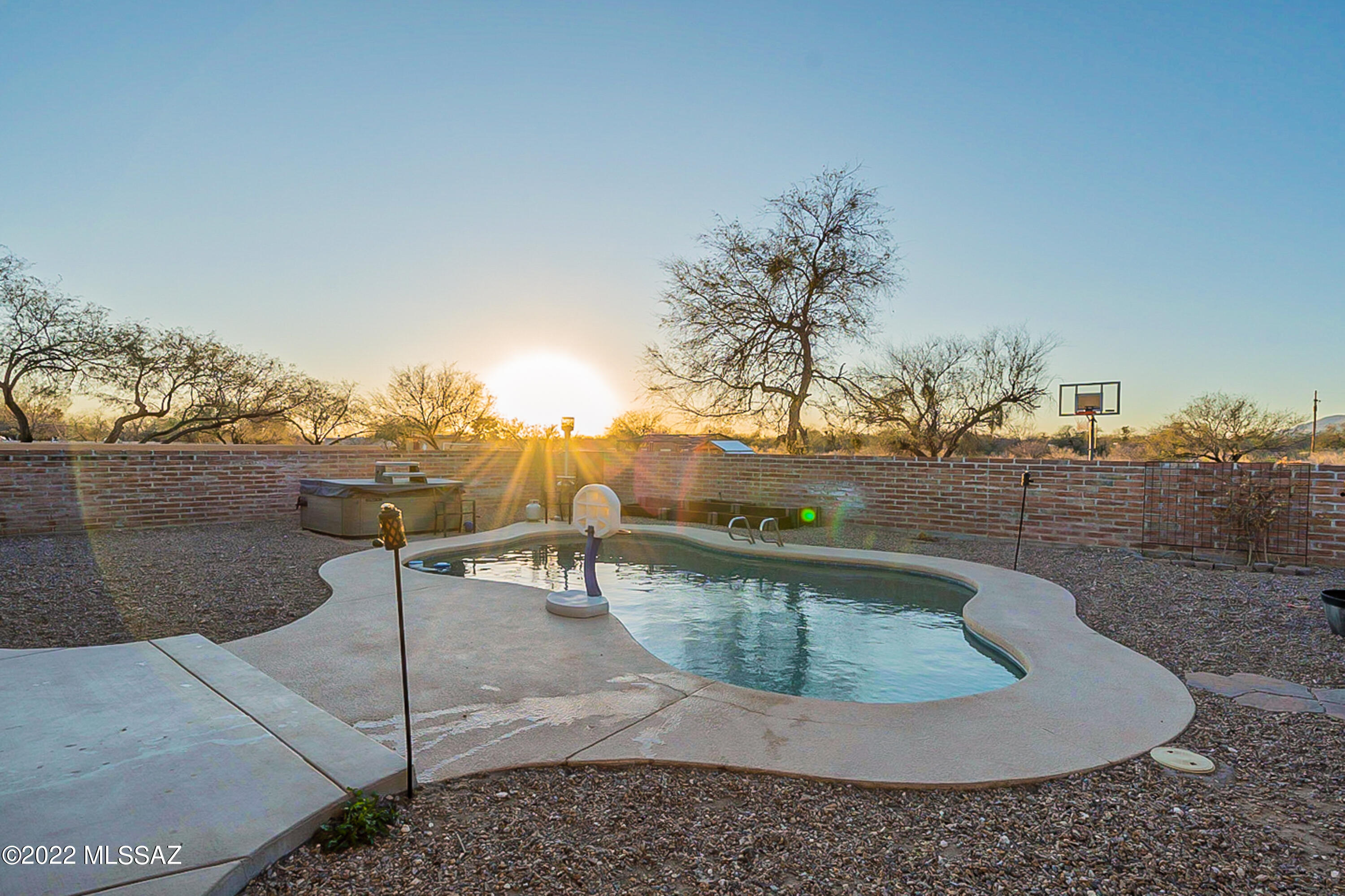 Stunning BEL AIR ESTATE home 3,000 sq ft - a true remodeled retreat located on 1.1 acres.  ENTIRE NEW 20K ROOF INSTALLED 3/7. Add in Pebbled-Tec POOL w/ new equip, Bullfrog Spa + 20k Lennox AC w/ SOLAR & Air Scrubber. SPLIT floor plan w/ a 4 BD, 3 Baths, Din Rm, Liv Rm, Fam Rm, Rec Rm & bonus 5 BD (off of garage has 220 Volts/ heated & cooled (prior workshop).  Kitchen & Great Rm are show worthy w/ FP & Alder cabinets - just redone in white, granite w/ subway tile, VIKING appliances + 6 burner gas cook-top & oven + VIKING Refrig. Oversized Master Suite, french door & huge walk closet.  Special treats: new circular driveway, fresh ext paint, 1/2 court basketball, Ramada & fire pit, built in kitchen, dog run + horses allowed. Metal Garage Doors. (HOME APPRAISED - BUYERS LOAN FELL THRU).