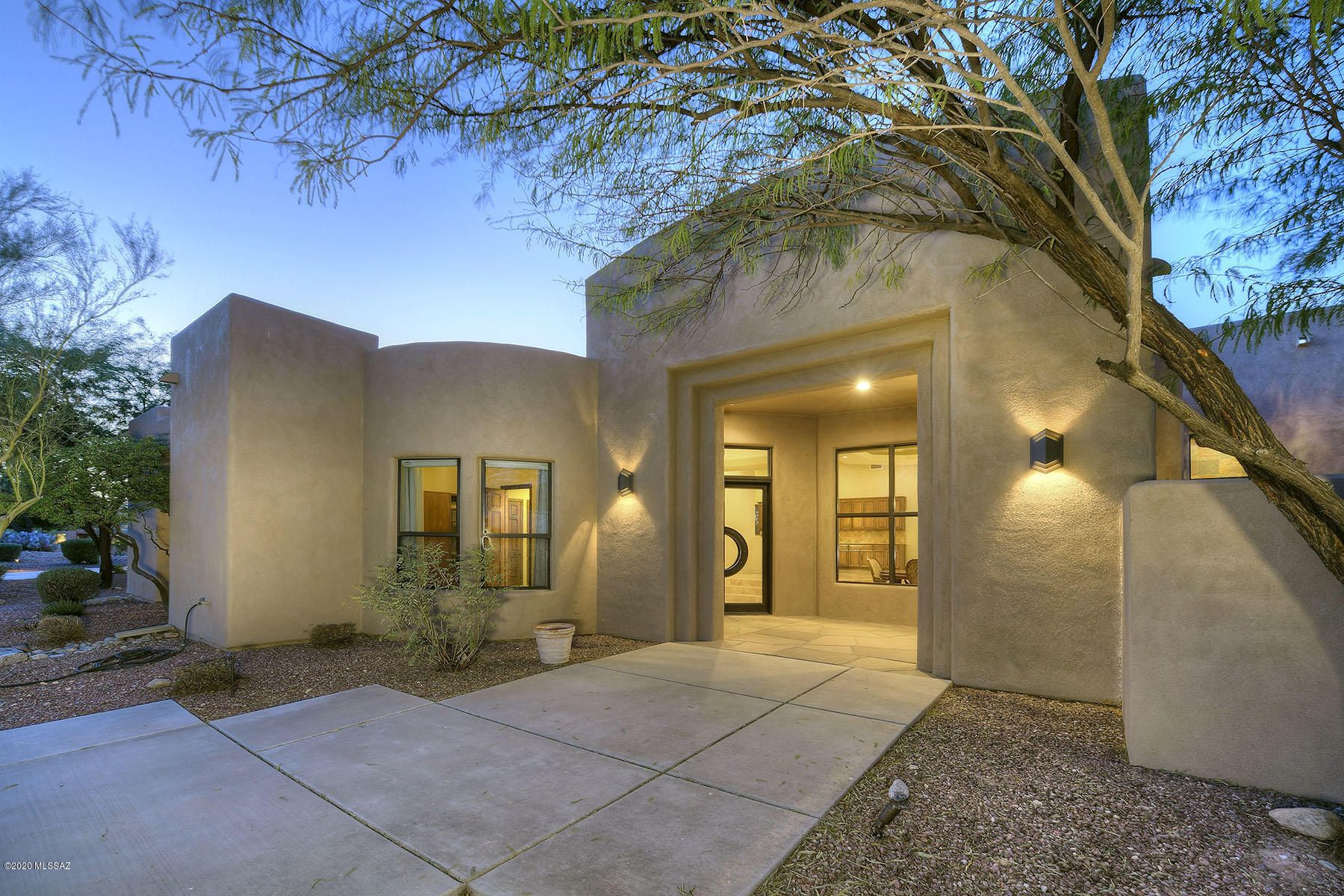 Contemporary 5 bed/4 bath custom home in gated Tucson Mtn Reserve boasts jaw dropping city & mountain views. Elevated 3.4 acres of Saguaro studded land surrounds. Enter through custom iron & glass door leading into large light filled great room w/ floor to ceiling windows. Expansive gourmet kitchen w/ granite counters, prep sink, 5 burner gas range, walk-in pantry, subzero wine fridge & so much more. Designer touches thru-out w/ slate & natural stone accents. Retreat to master suite w/ fireplace, access to patio & walk-in closet. Mountain views from jacuzzi tub which also features dual vanities & spacious separate shower. Guest bedrooms boast en-suite baths. Pebble tech pool, spa, 2 built in BBQ's on either side of home, gas fire-pit & lg. patios complete your desert oasis. 3 car garage.